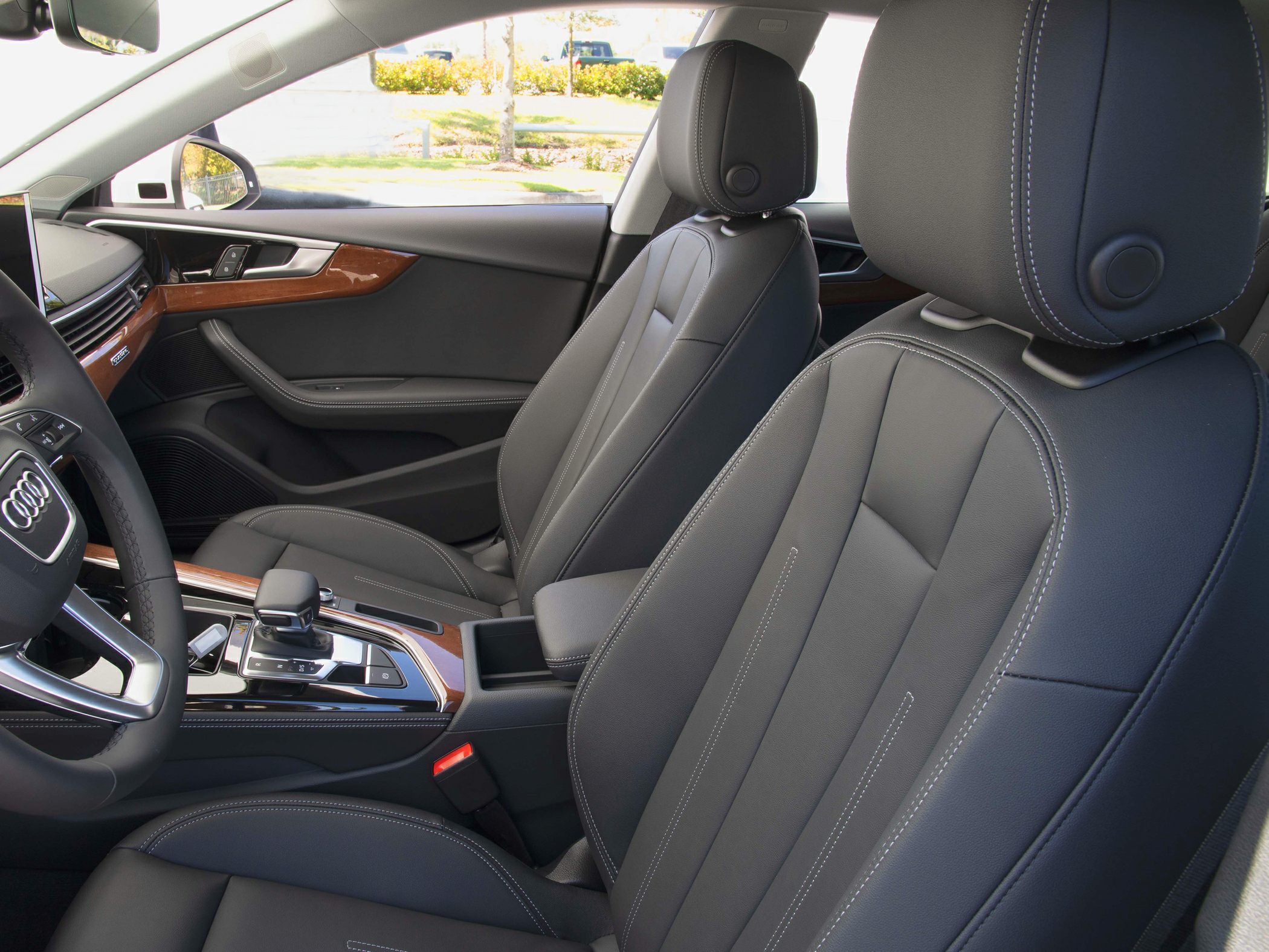 Front seats with leather upholstery and wood-trimmed dashboard
