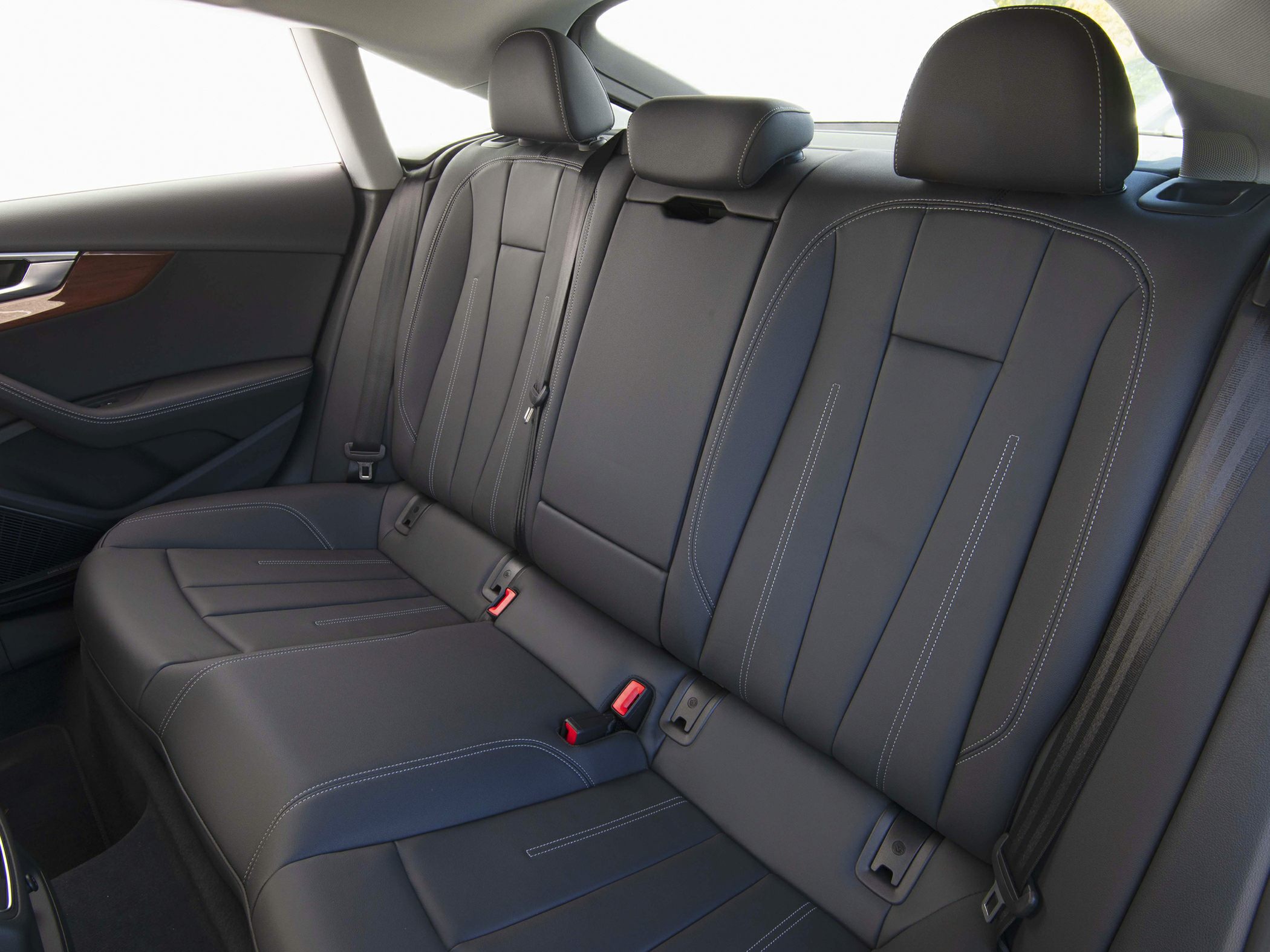 Rear seat with premium leather upholstery and modern design.