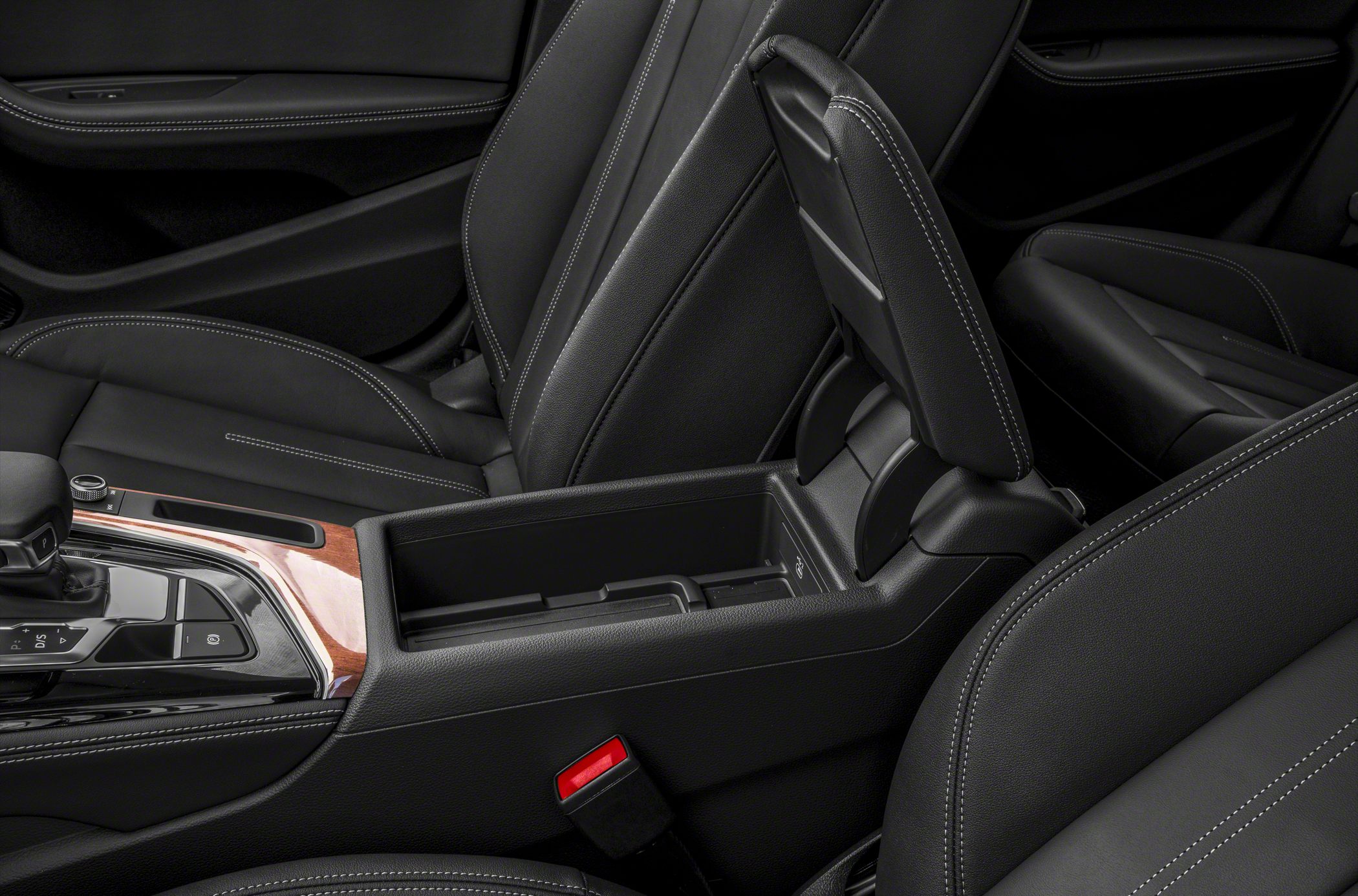 Closed center console storage with gear selector in black leather interior