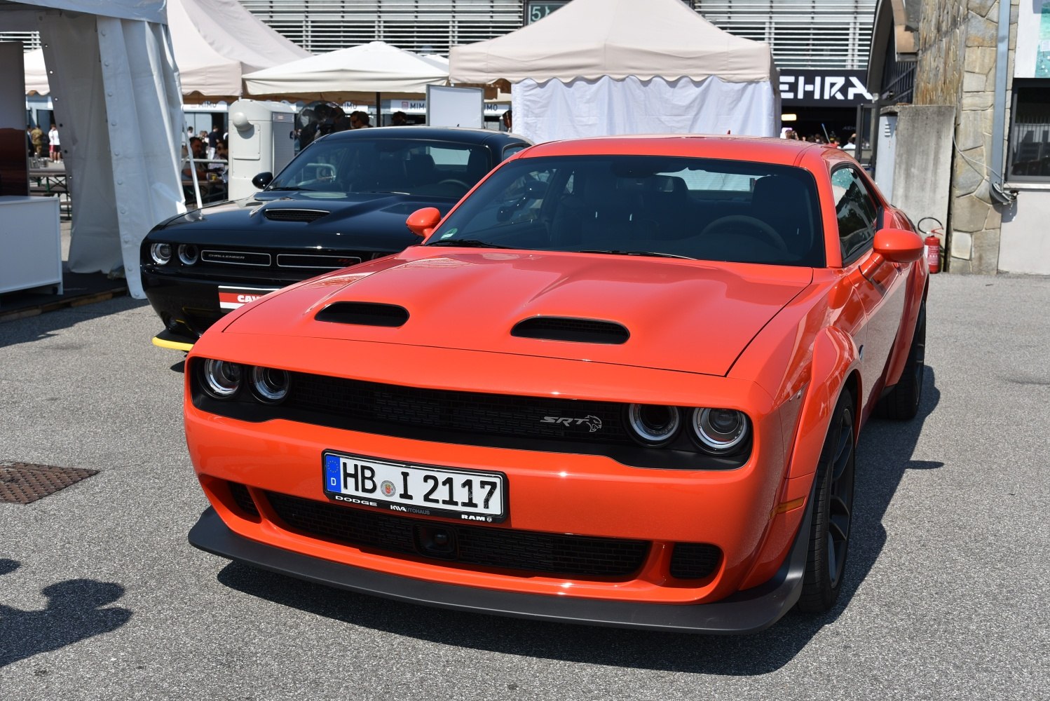 Front view of muscle car with dual hood scoops and black grille