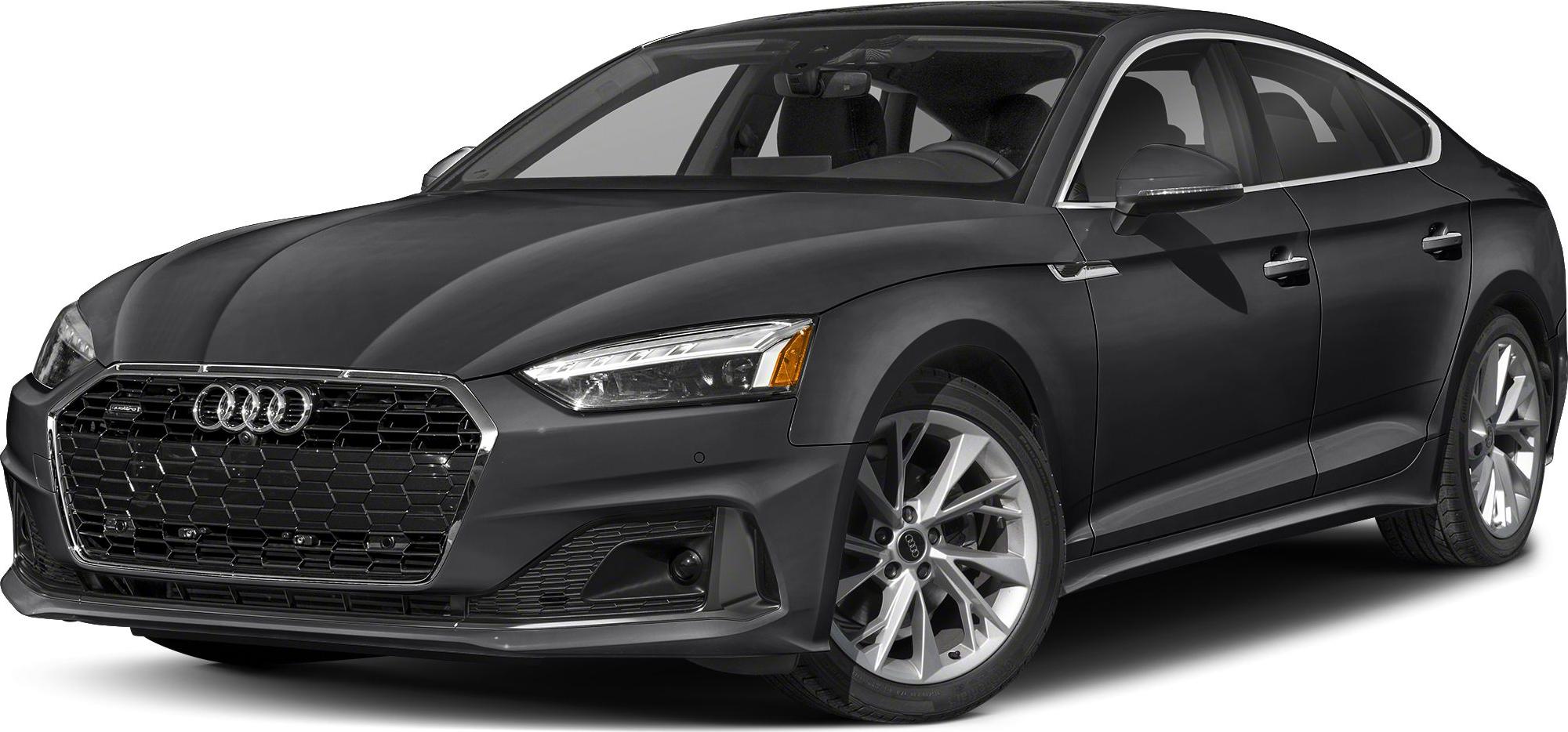 Front side view of sedan with hexagonal grille and alloy wheels