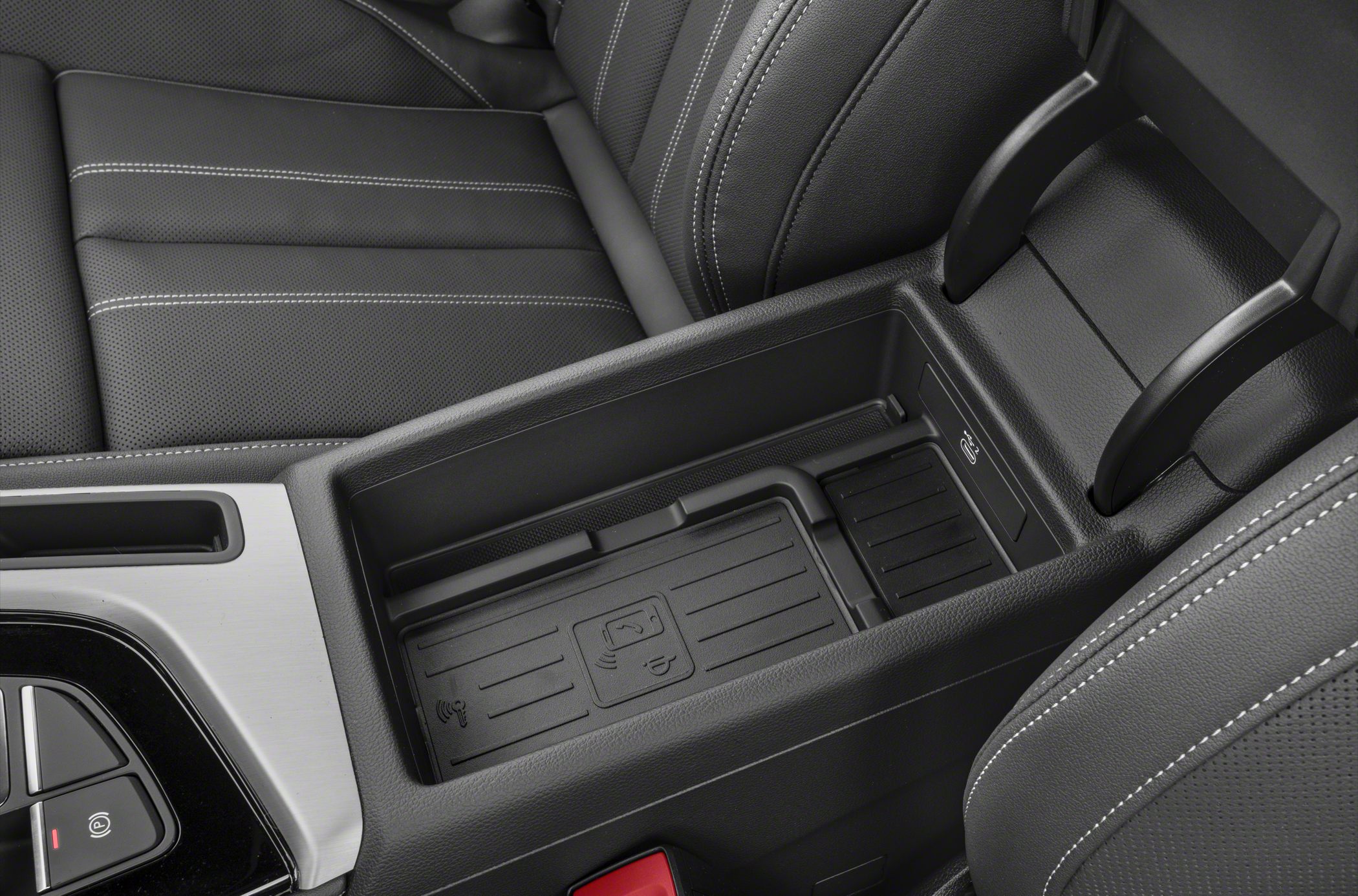 Wireless charging pad and black leather center console storage
