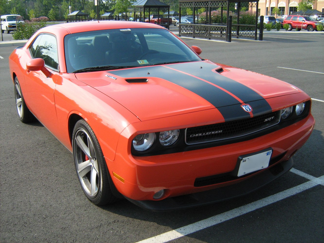Front view showing hood vents, racing stripes, and aggressive headlights.