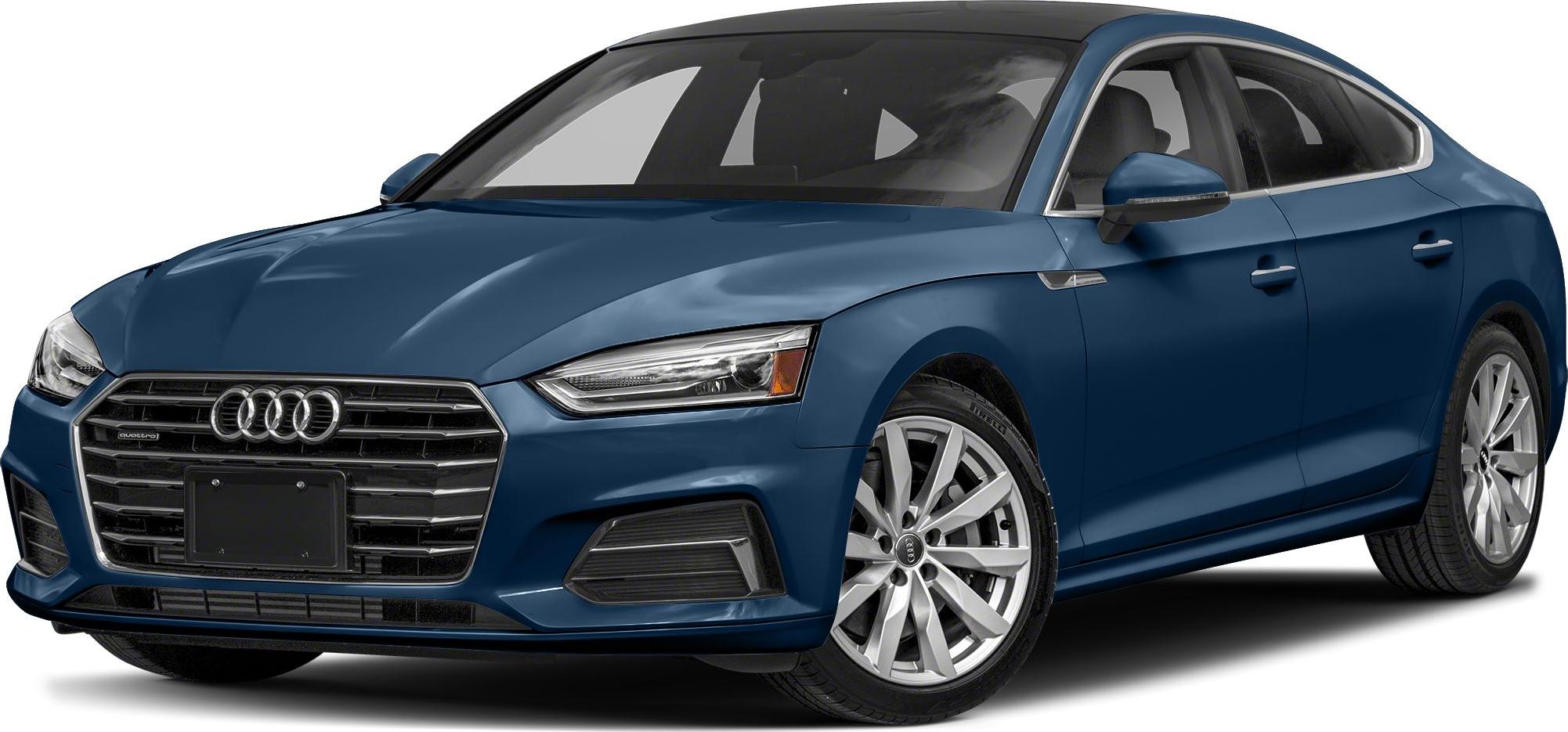 Front grille with four-ring emblem and alloy wheel design
