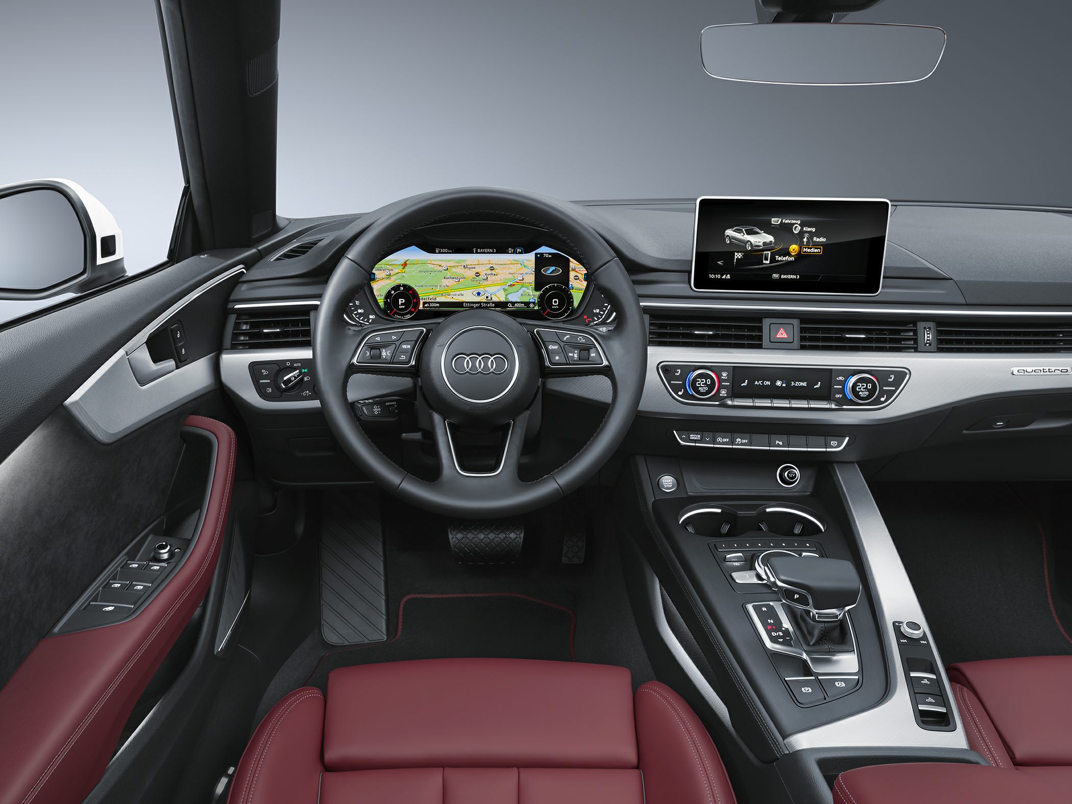 Digital dashboard with navigation, infotainment screen, red leather seats