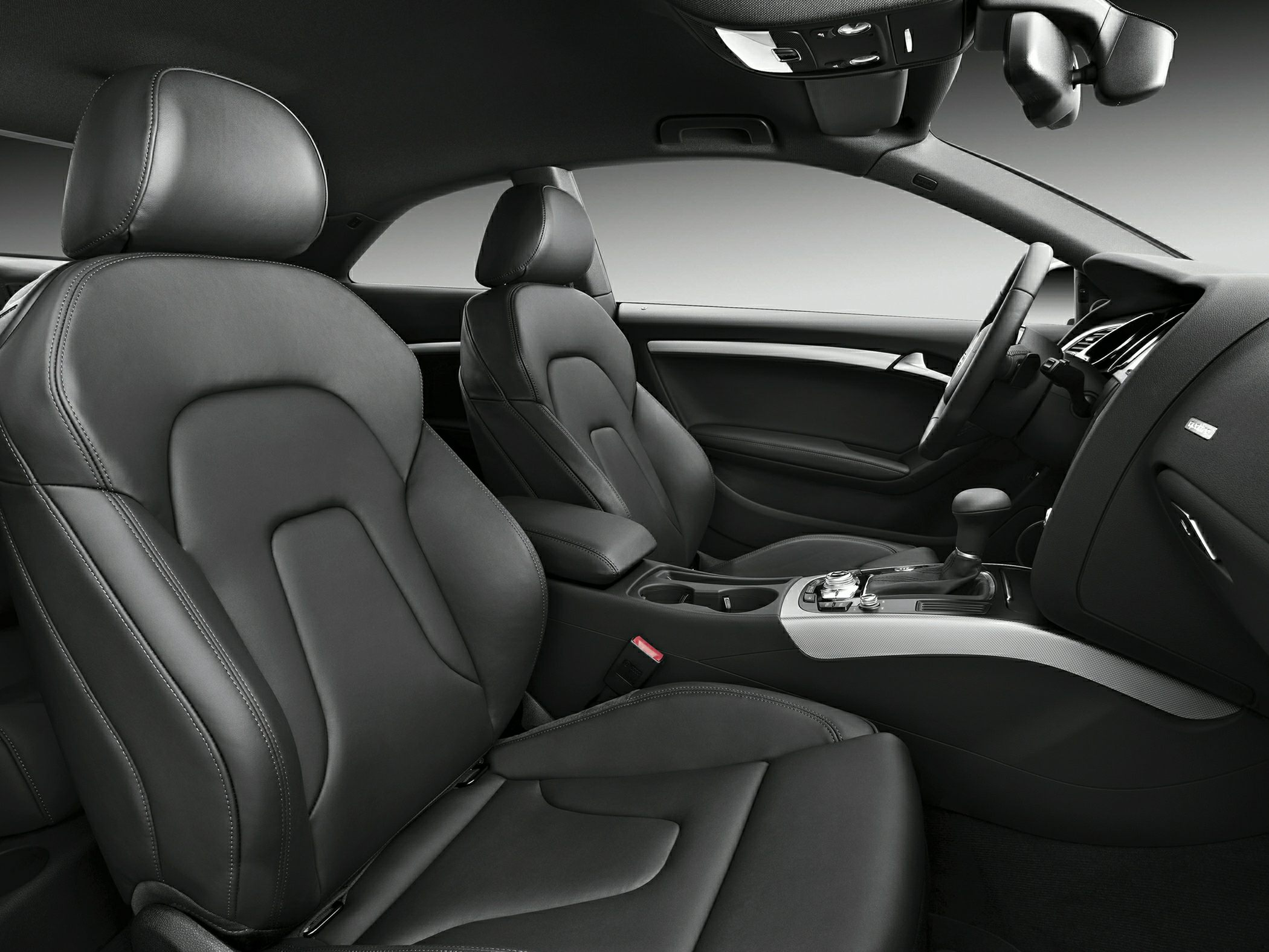 Luxury car interior with leather seats and modern central console