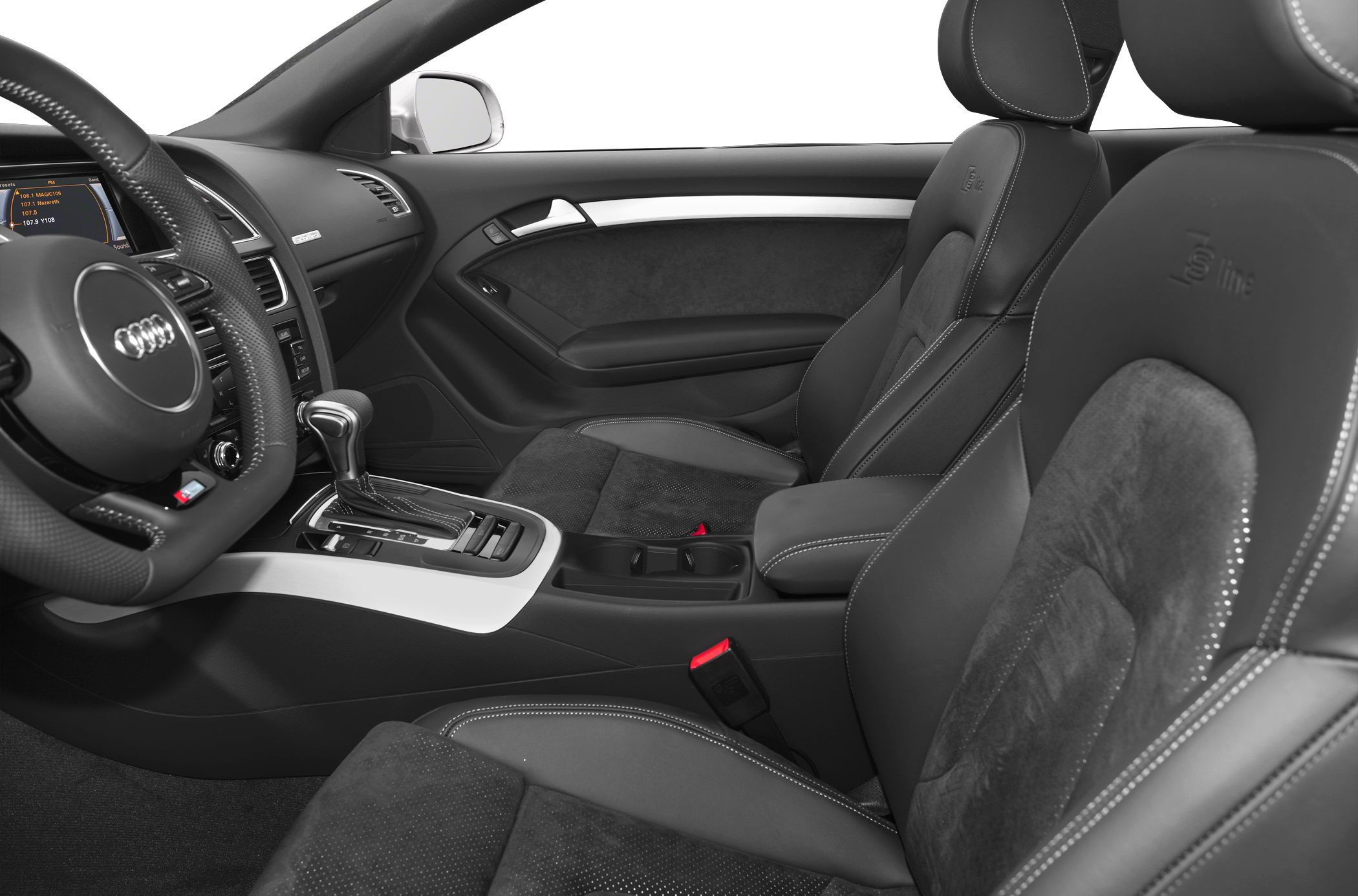 Close-up of black leather and suede sport seats with dashboard and gearshift.