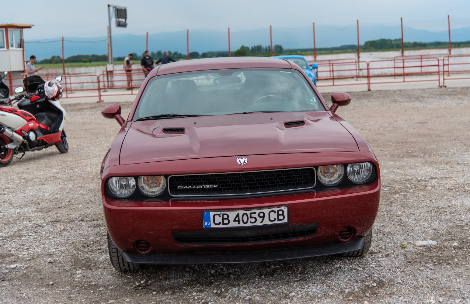 Front view with dual hood scoops and quad round headlights