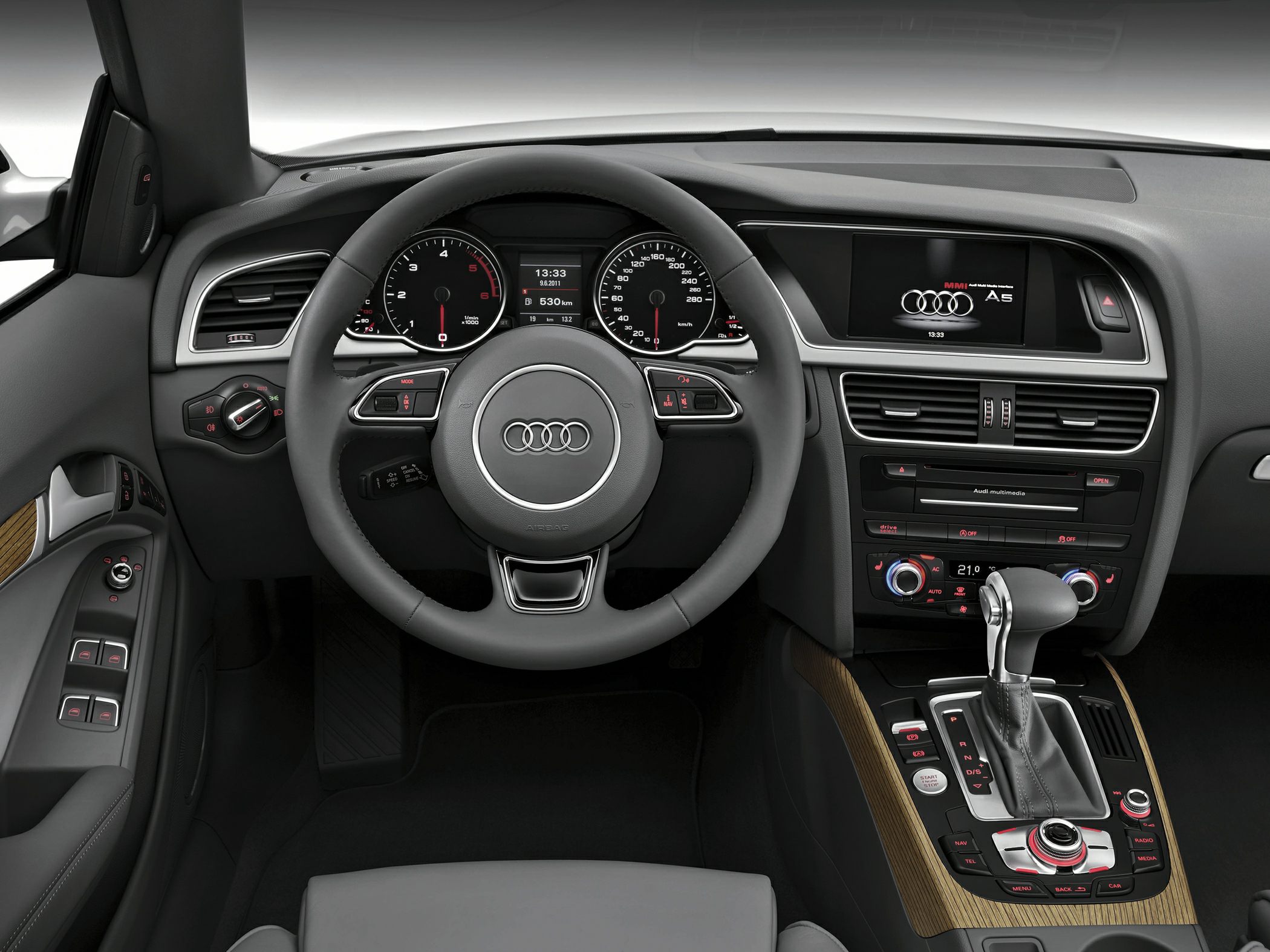 Audi interior dashboard with steering wheel and multimedia center console