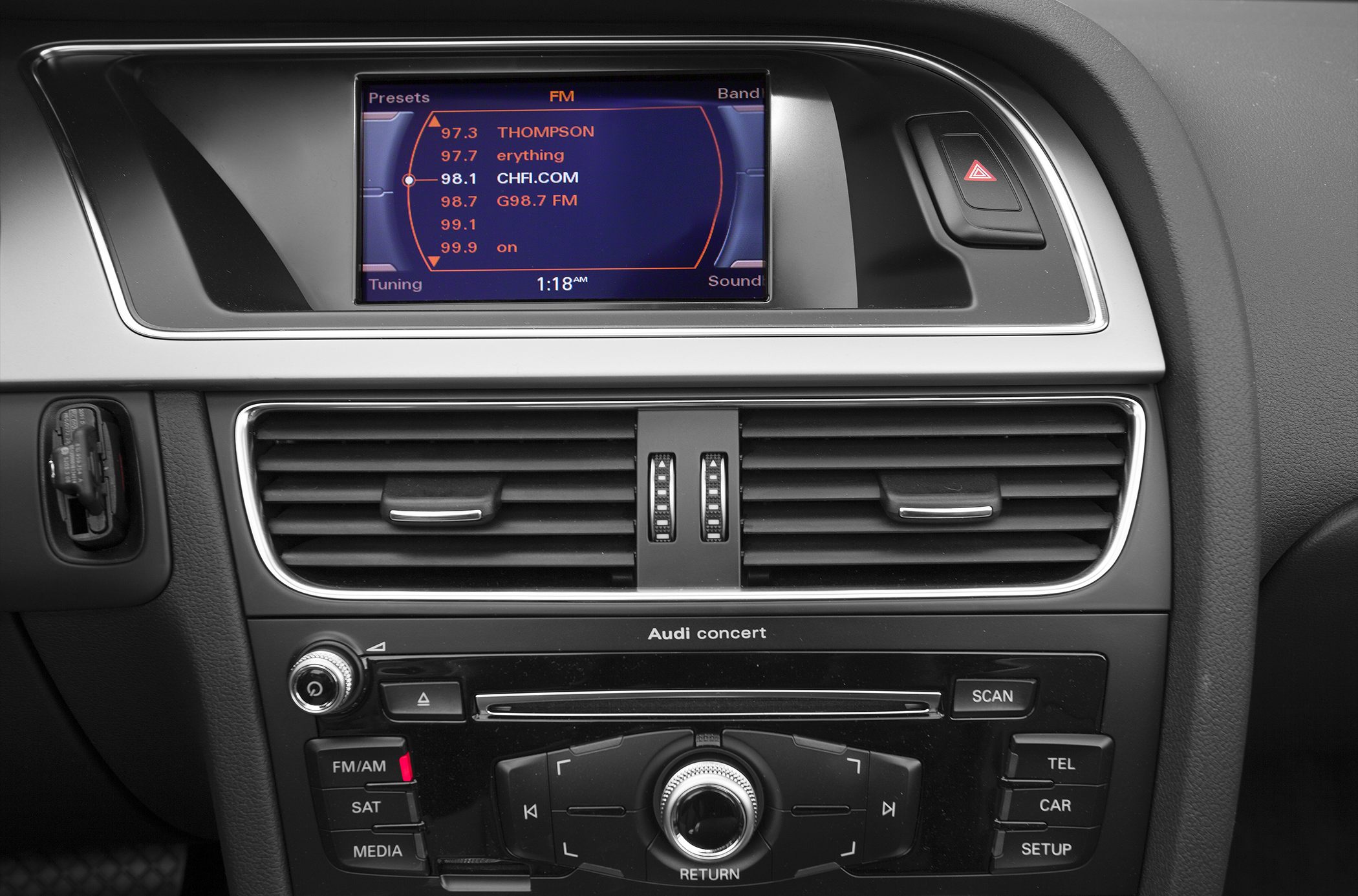 Car multimedia display and center control panel with air vents and buttons