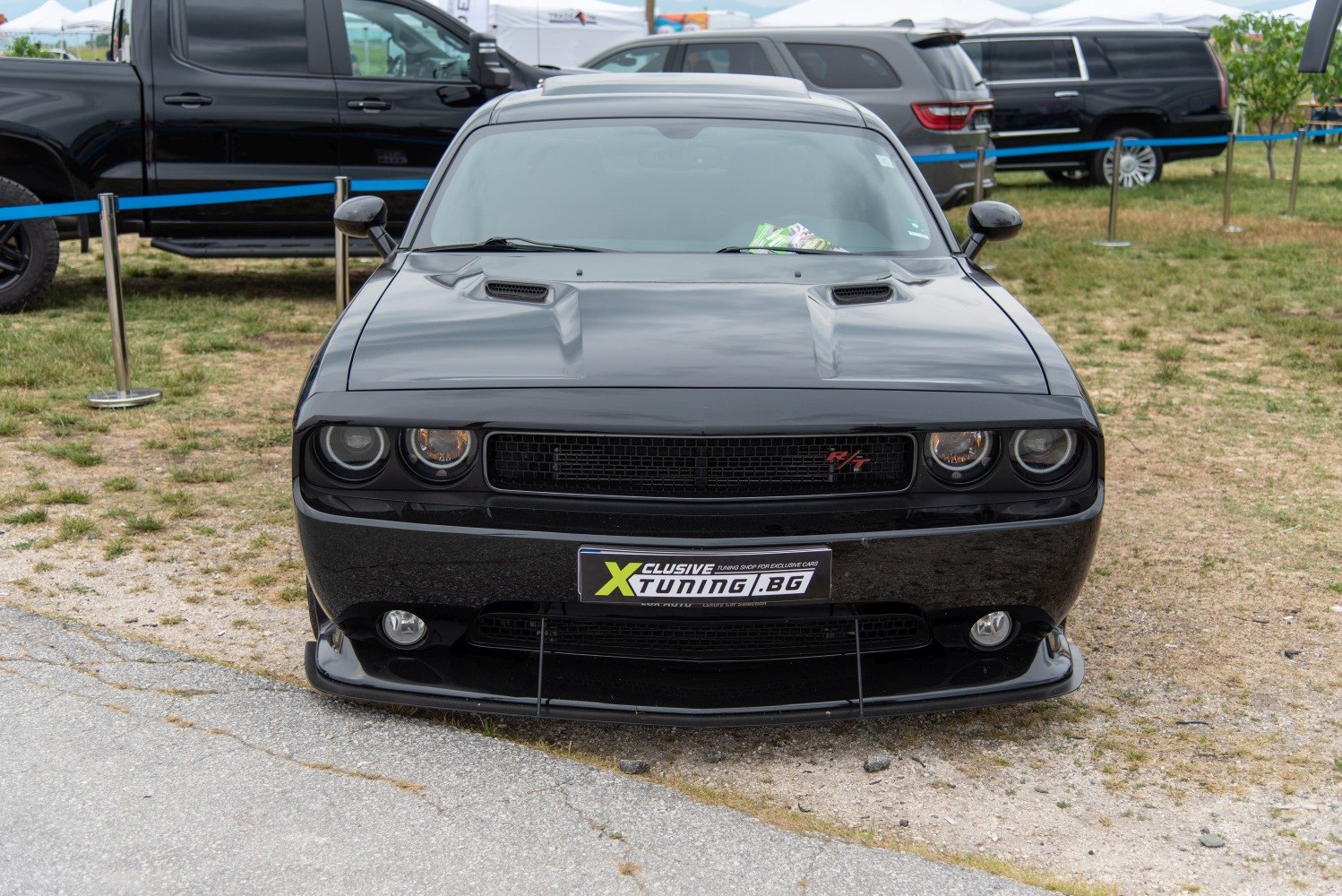 Aggressive front fascia with dual hood scoops and round headlights