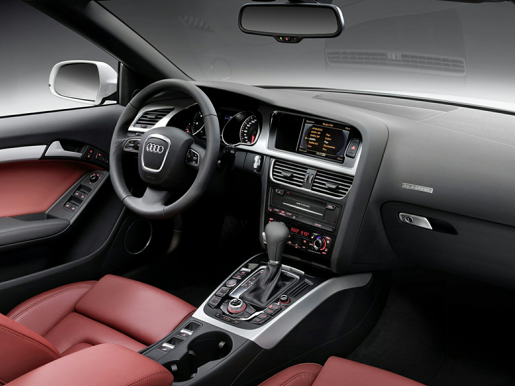 Luxury interior with leather seats, advanced dashboard, and automatic gear shift.