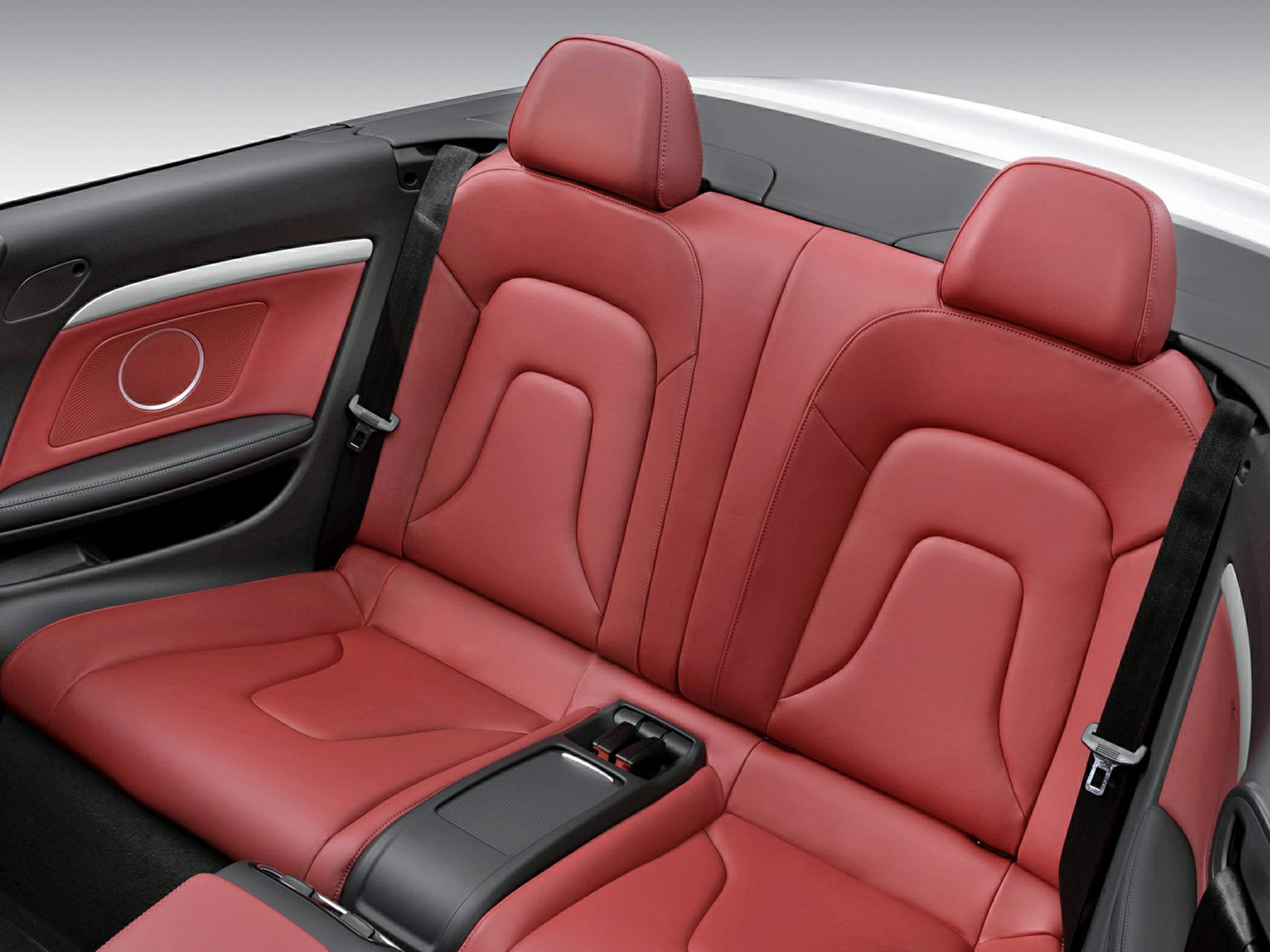 Red leather rear seats with headrests and center console