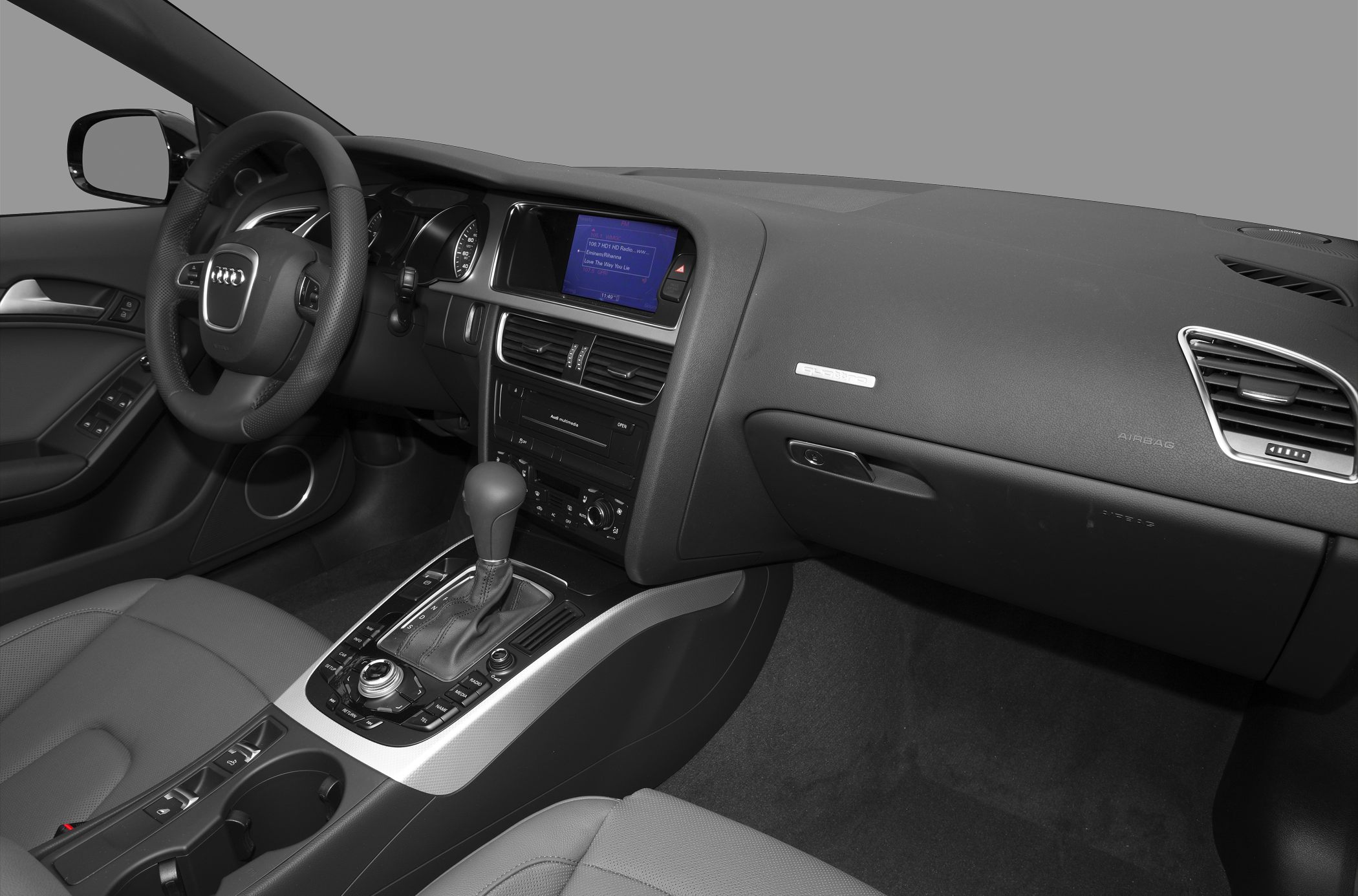 Interior dashboard, steering wheel, and center console