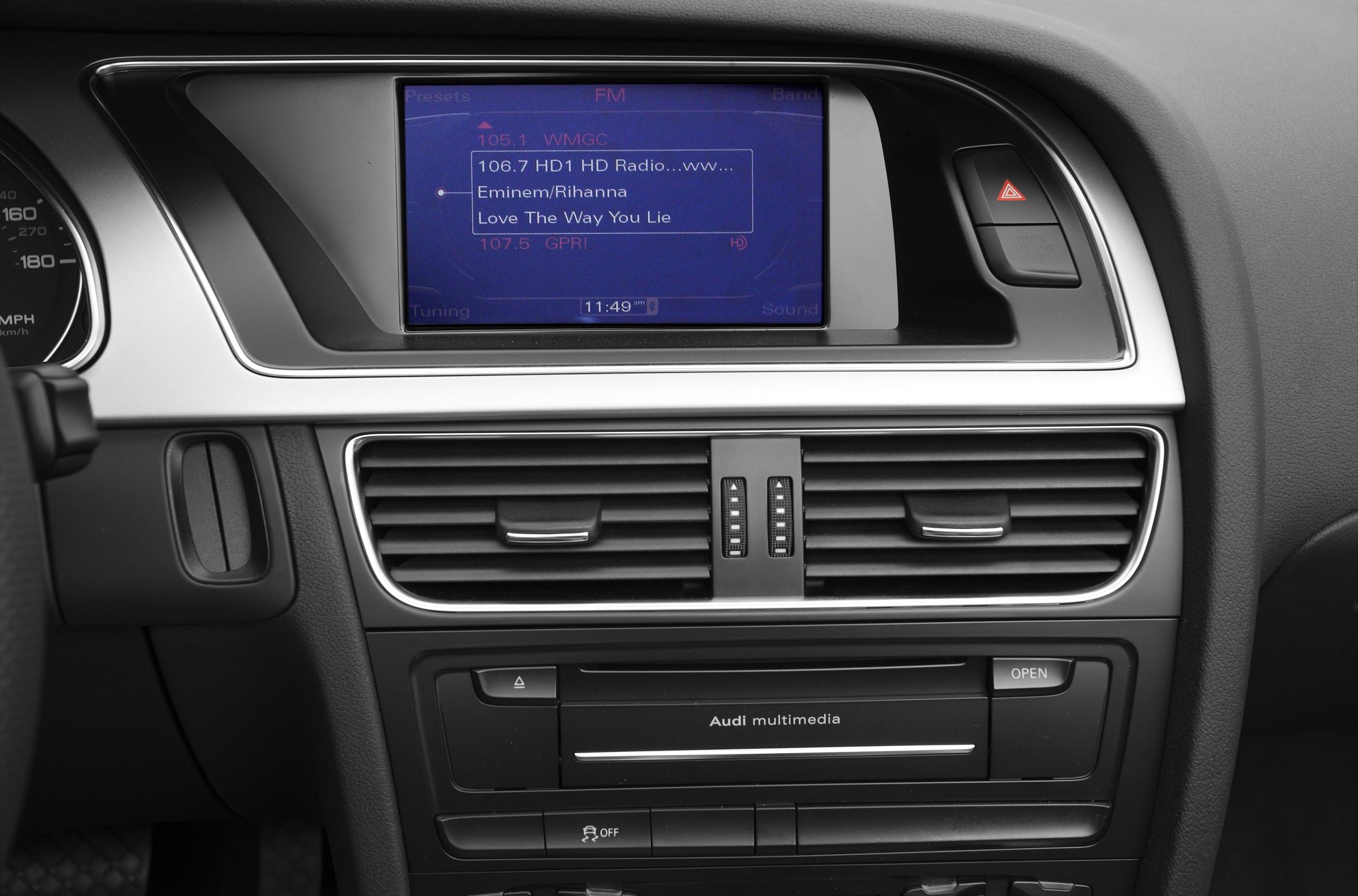 Multimedia screen and dashboard air vents in car interior