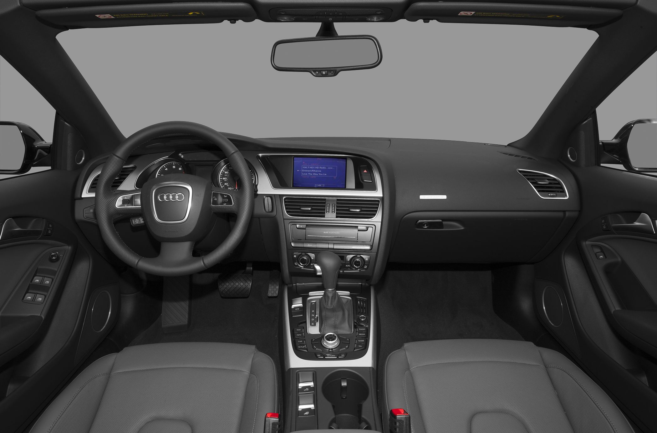Dashboard, steering wheel, and center console interior layout