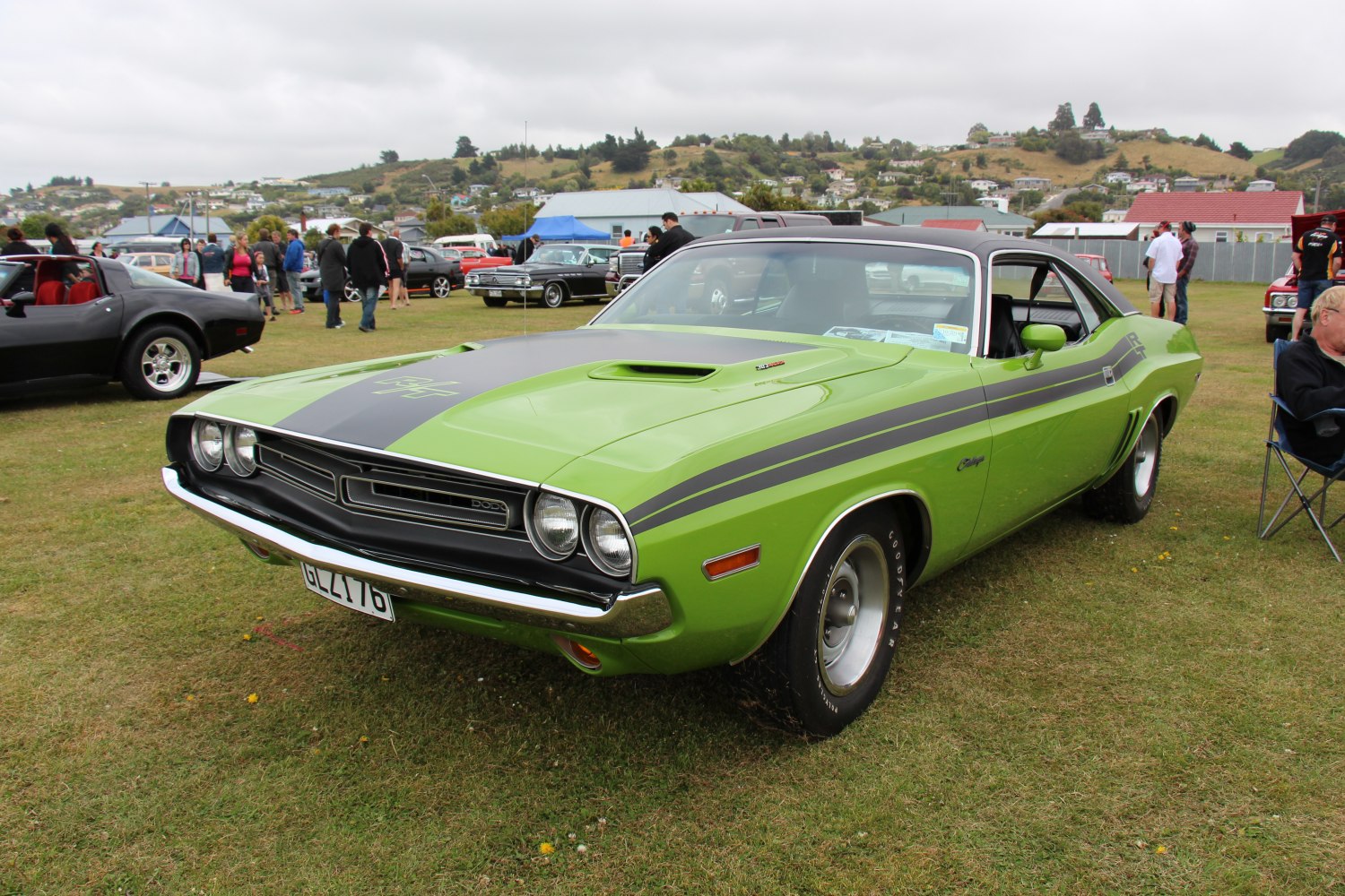 Front angled muscle car with hood scoop and racing stripe
