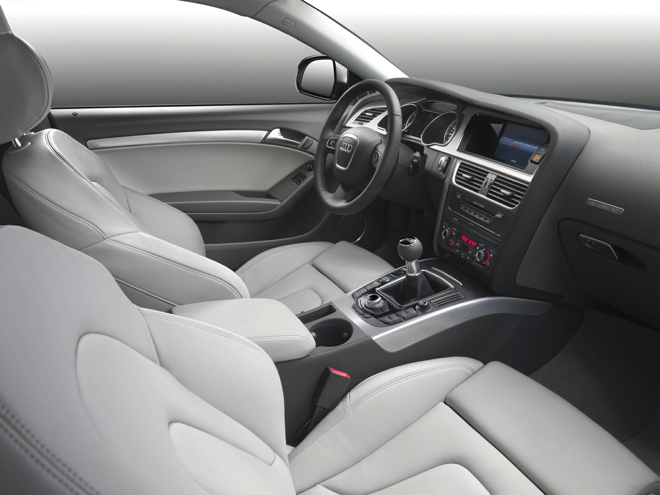 Luxurious leather seats and advanced dashboard interior with manual gear lever.