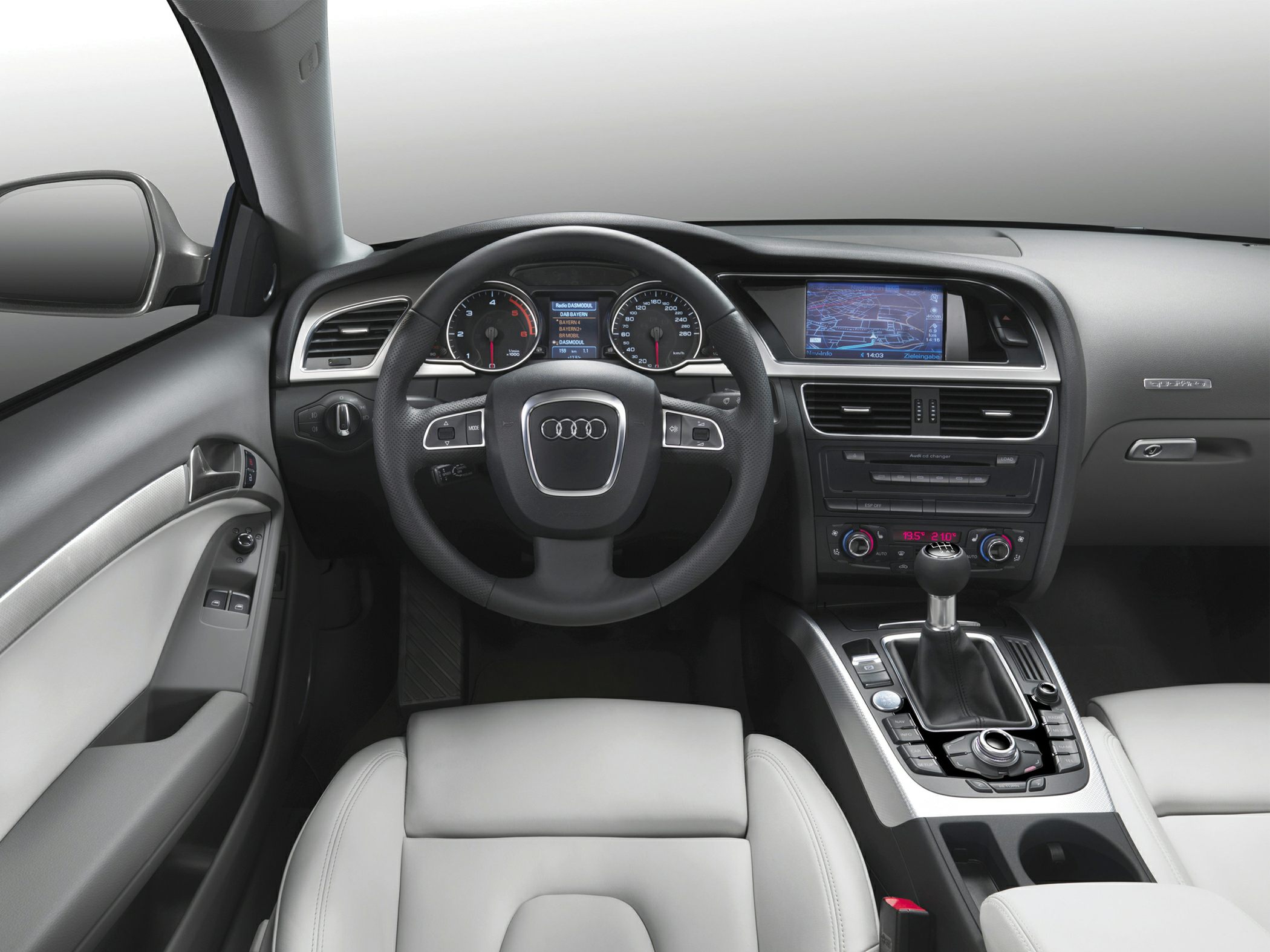 Dashboard, steering wheel, and center console with manual gear shift