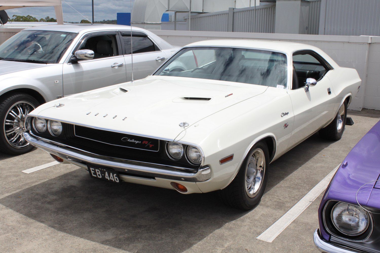 1970 muscle car front with hood scoops and dual round headlights