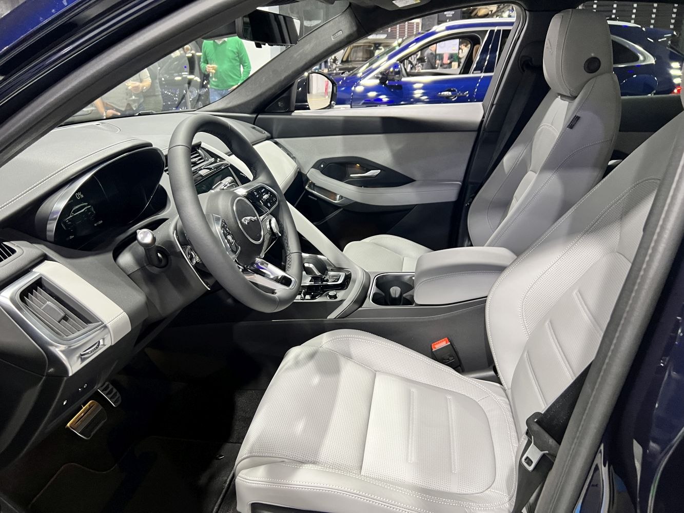 Modern dashboard with digital display and leather seats in car interior