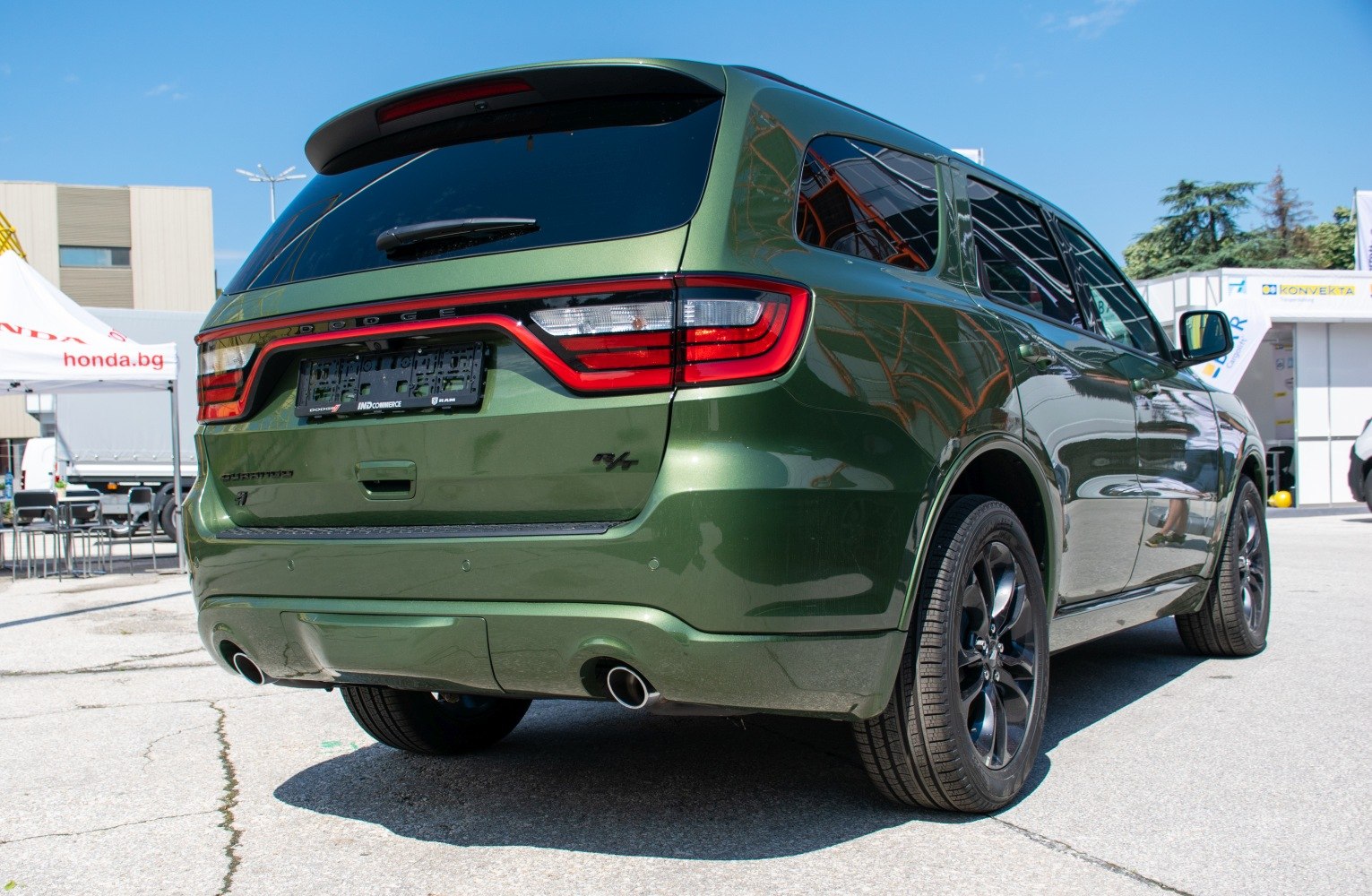 Rear view of an SUV with LED taillights and dual exhaust pipes