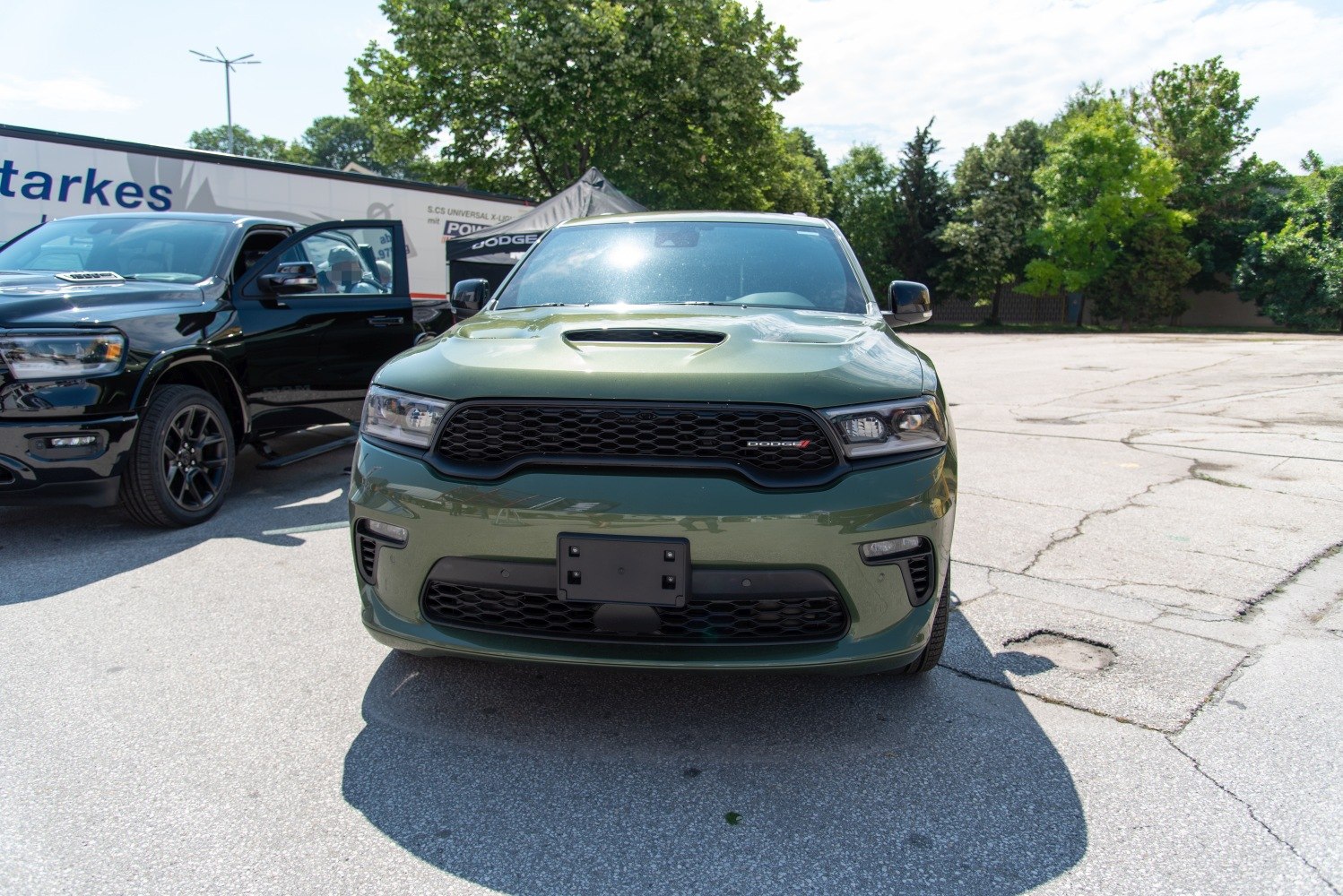 Aggressive grille and hood scoop on SUV front view