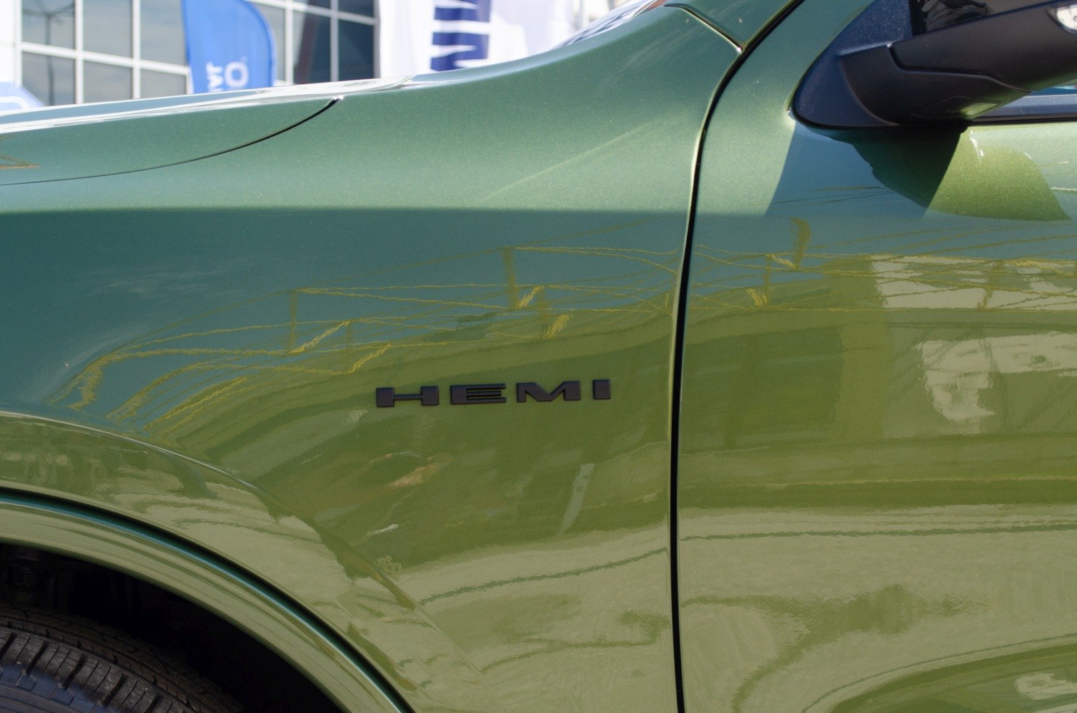 Close-up of green Dodge Durango fender with HEMI badge