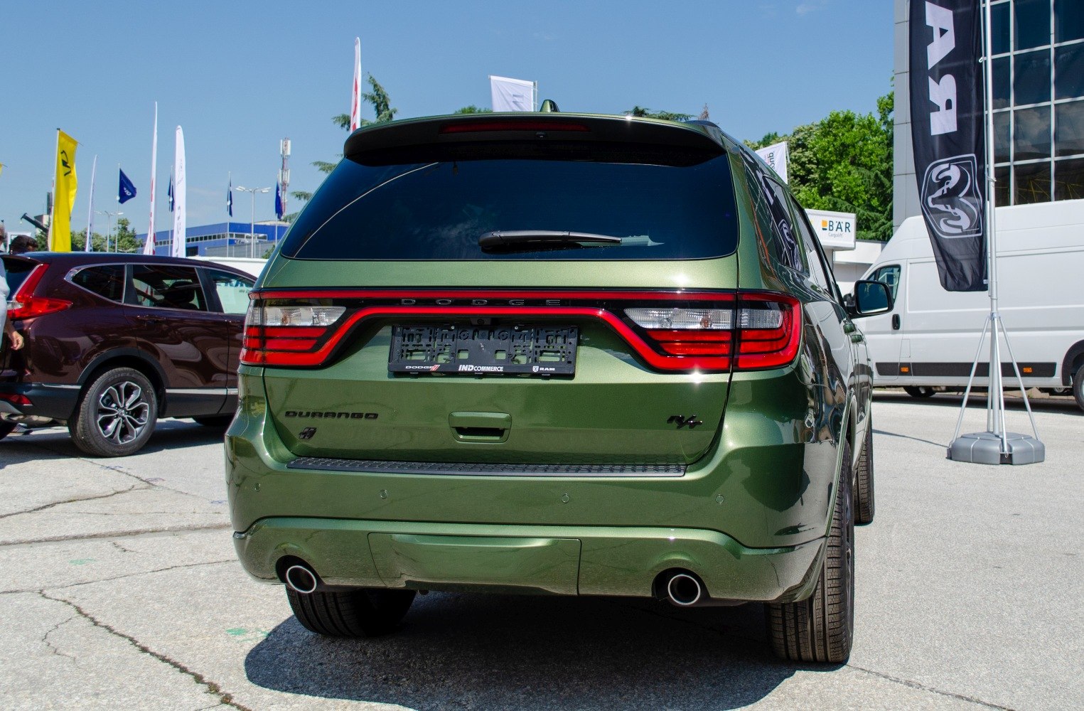 SUV rear view with LED tail lights and dual exhausts