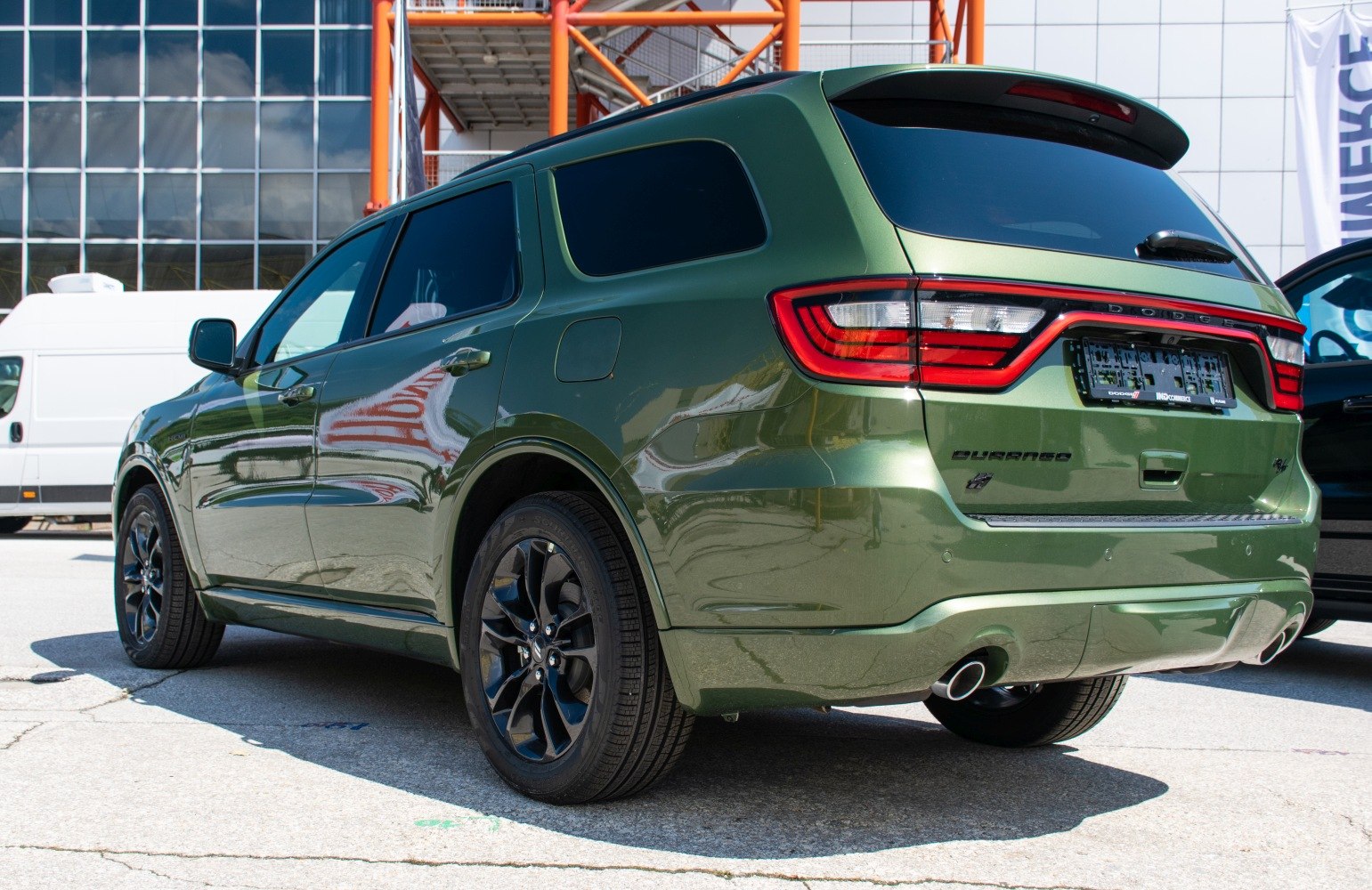 Rear and side view of SUV with black wheels and LED taillights