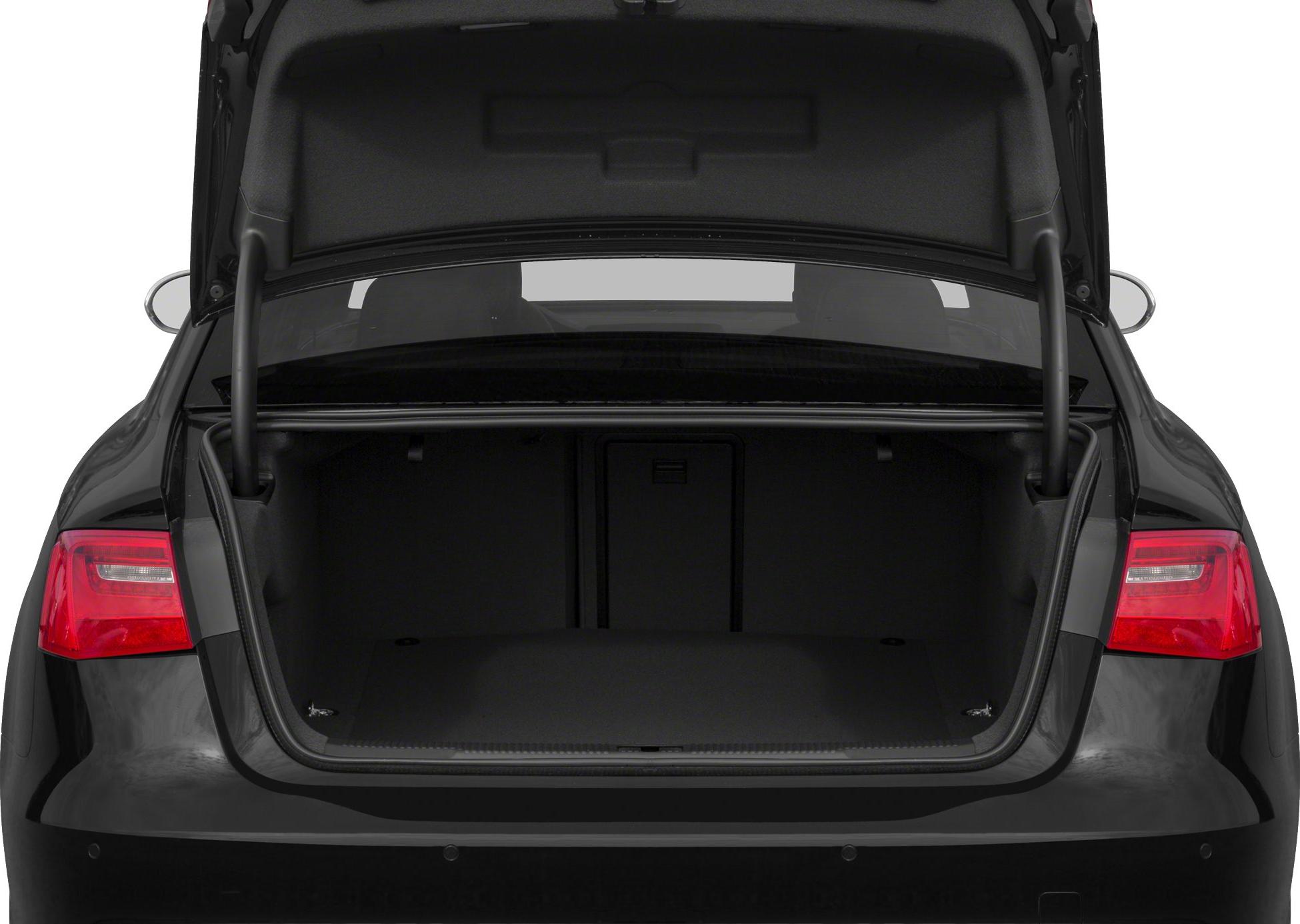 Open trunk space and rear taillights of a black sedan