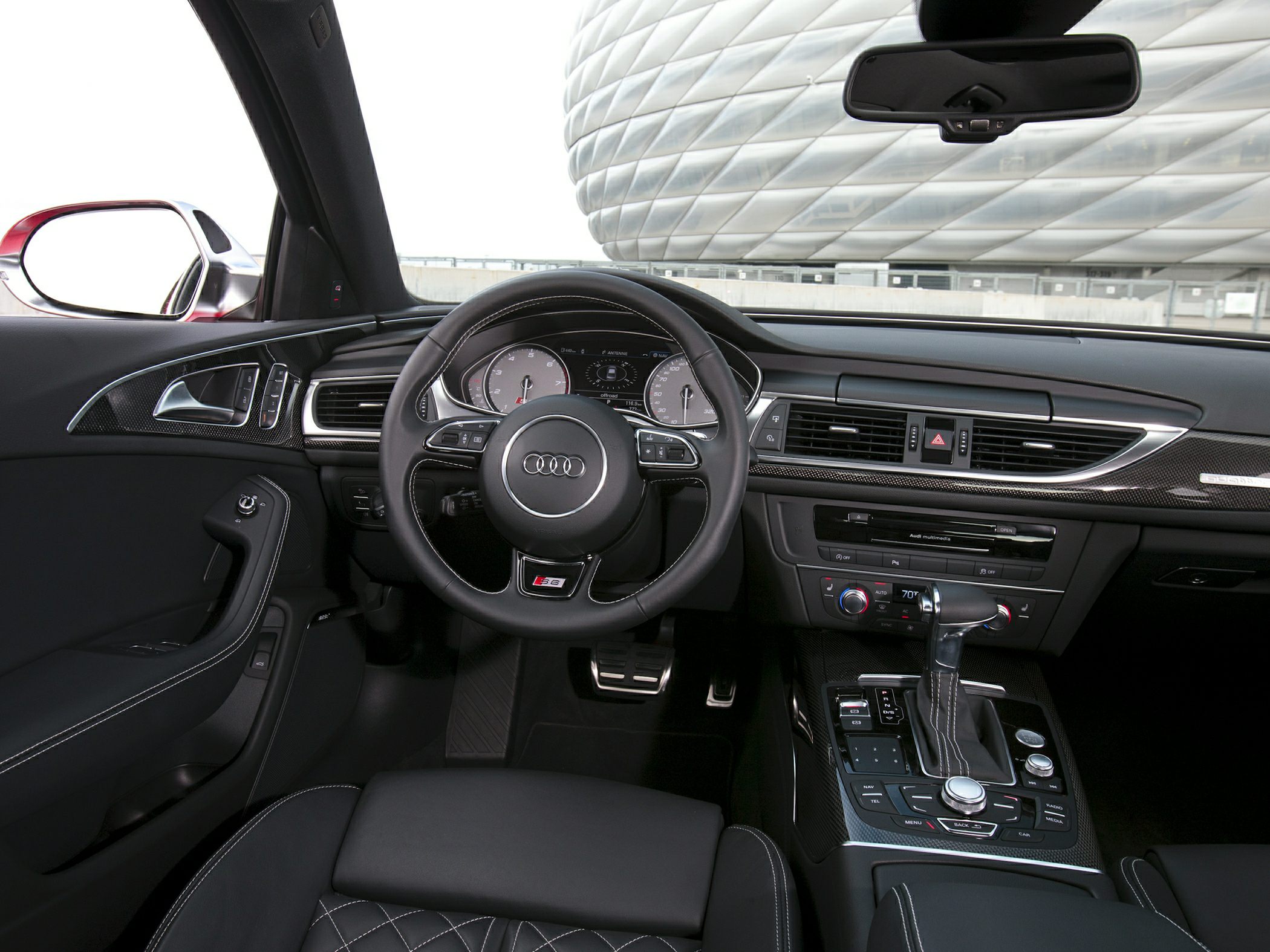 Luxury dashboard, quilted leather seats, multimedia center console.