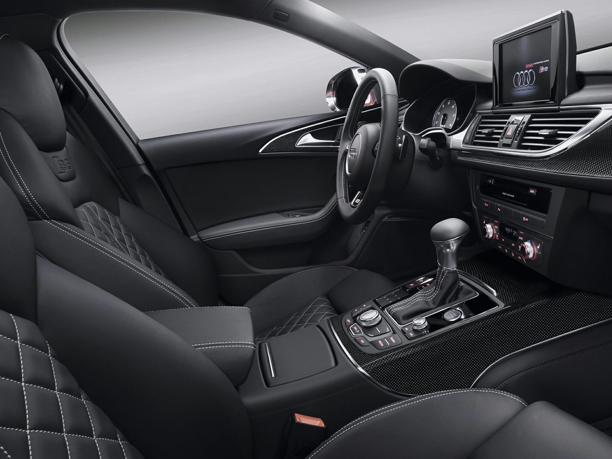 Quilted sport seats with leather stitching and central infotainment screen