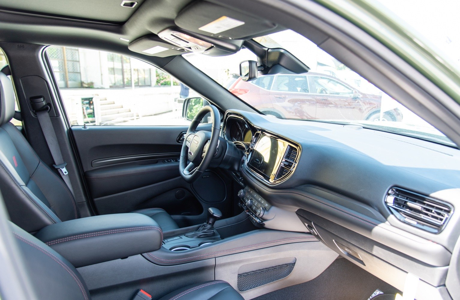 Modern SUV interior with touchscreen dashboard and leather seating