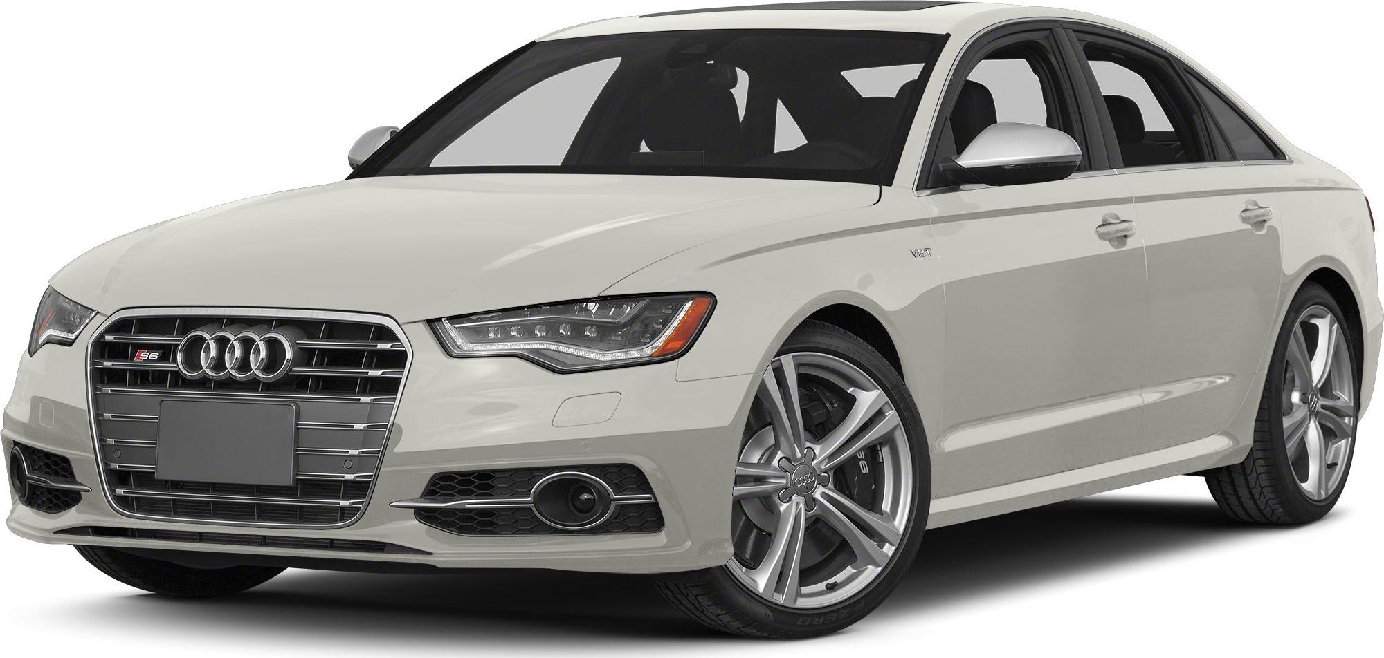 Front grille with Audi logo and LED headlights of a sleek luxury sedan.