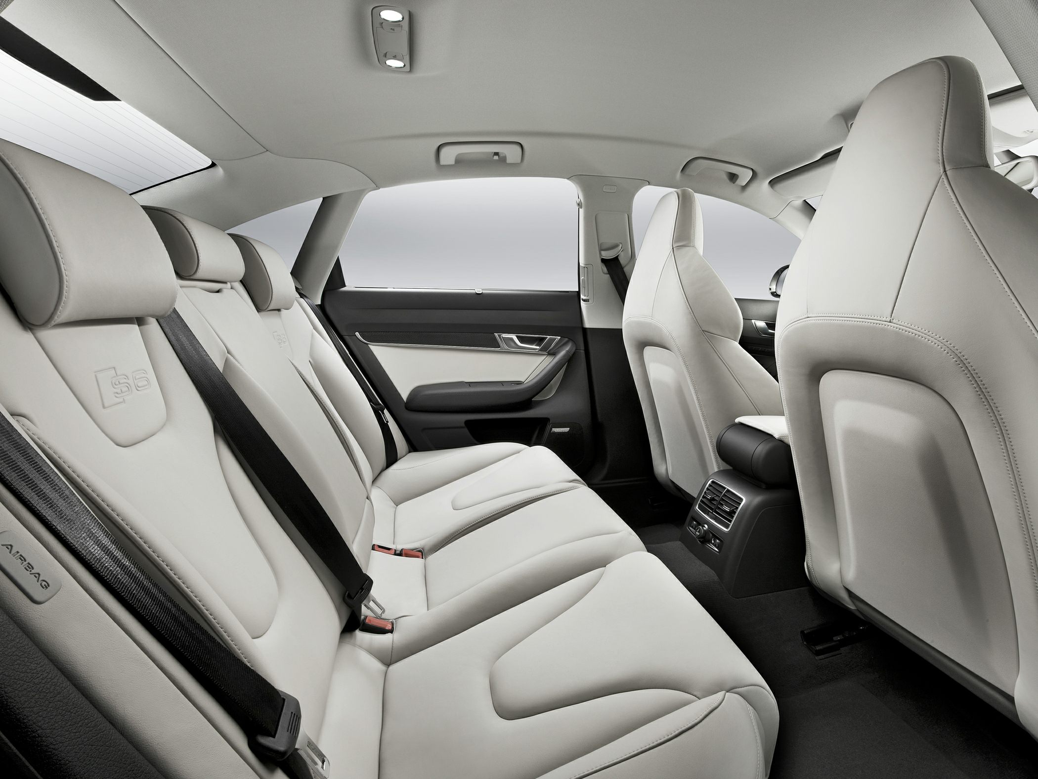 Premium light leather rear seats with air vents and ergonomic design