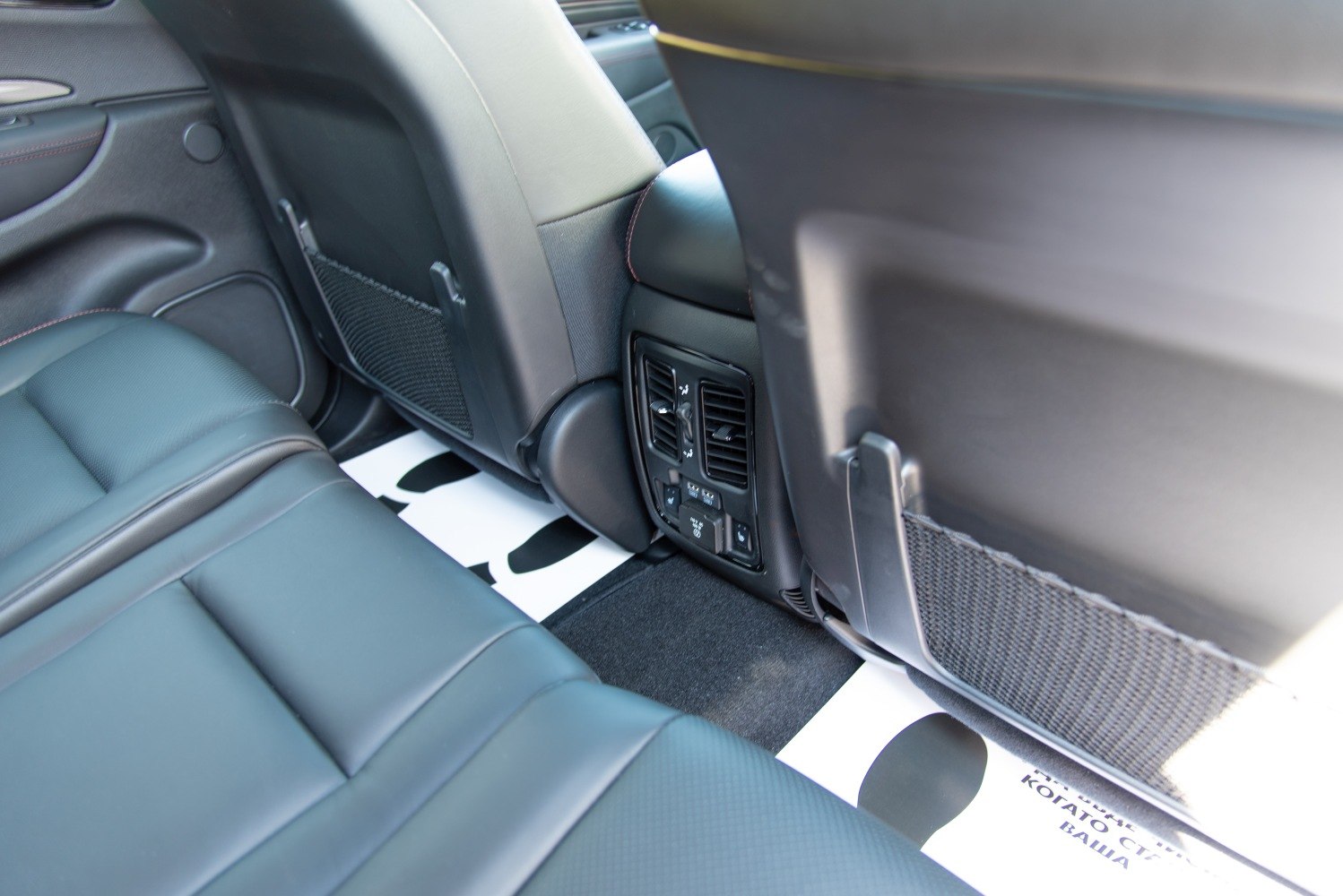 Rear seat air vents, climate control, and storage pockets