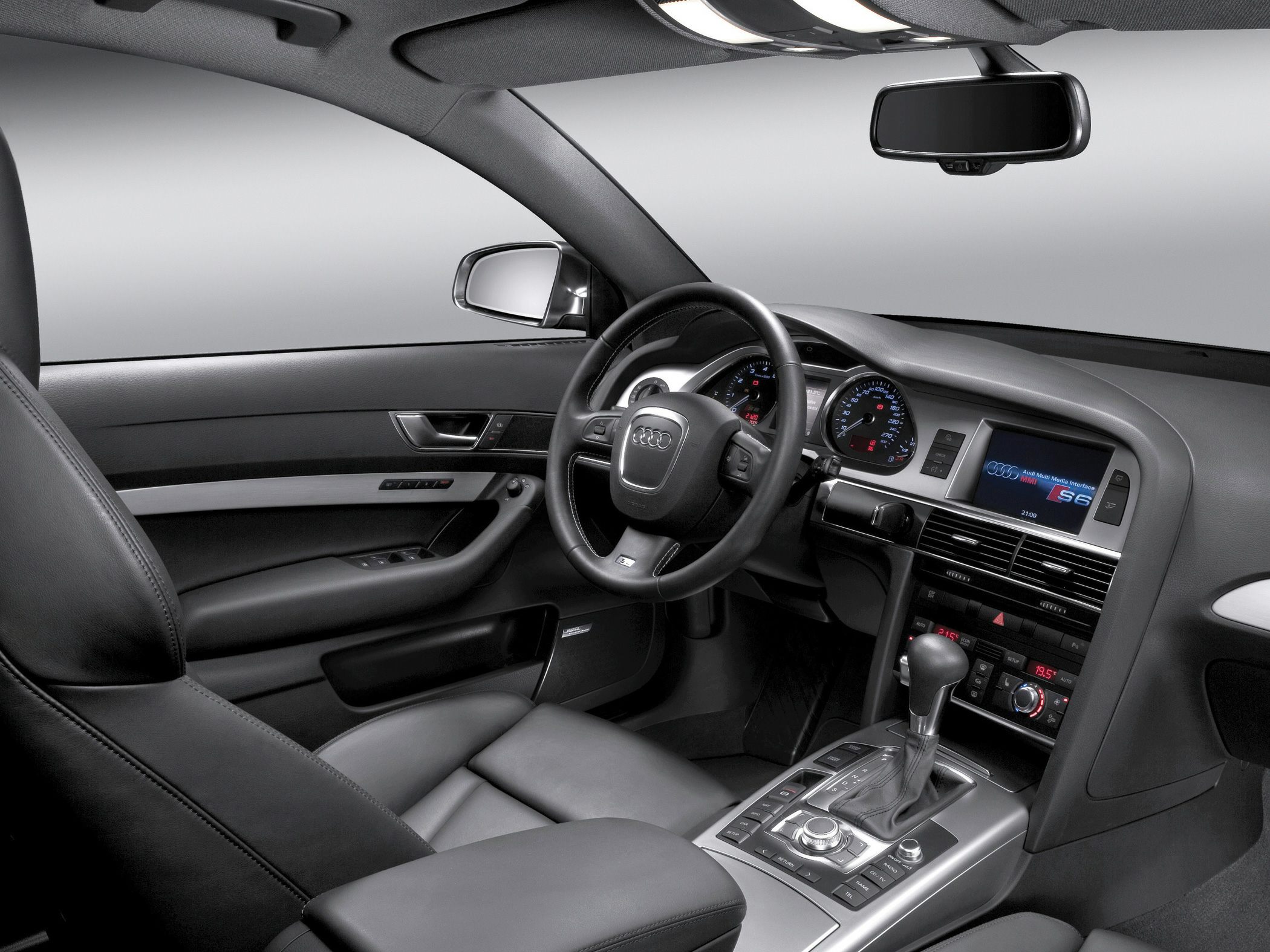 Interior view showing dashboard, steering wheel, and multimedia interface system.