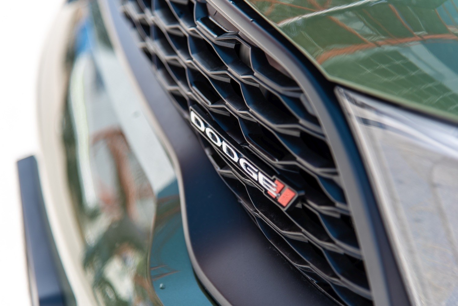 Close-up of hexagonal grille with Dodge badge on fascia