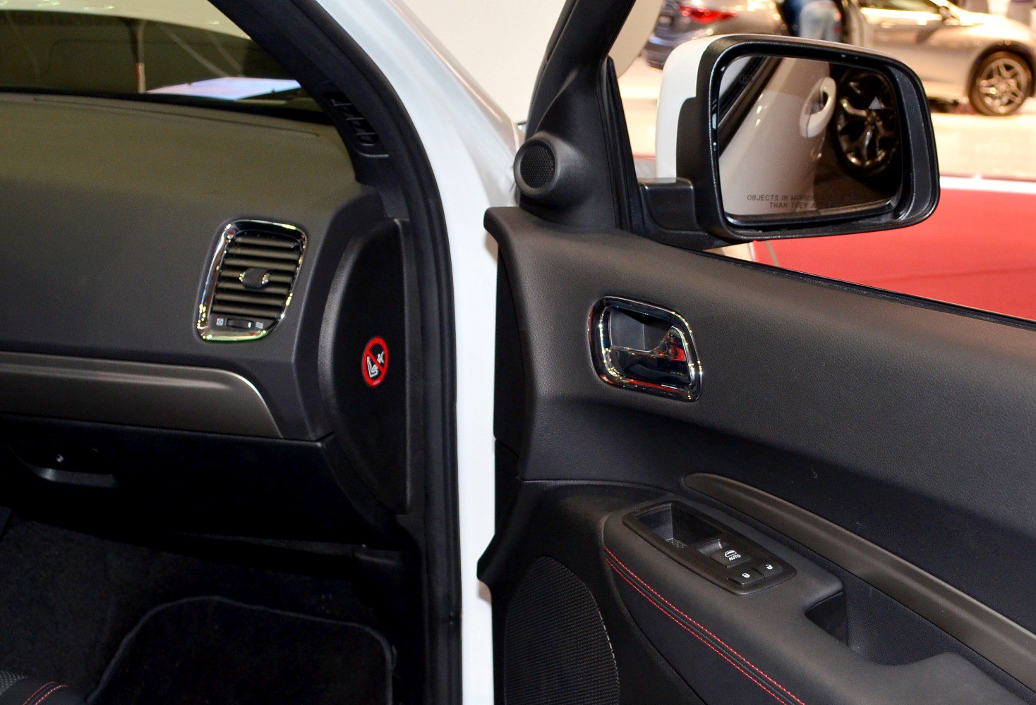 Interior door panel with window controls and side mirror