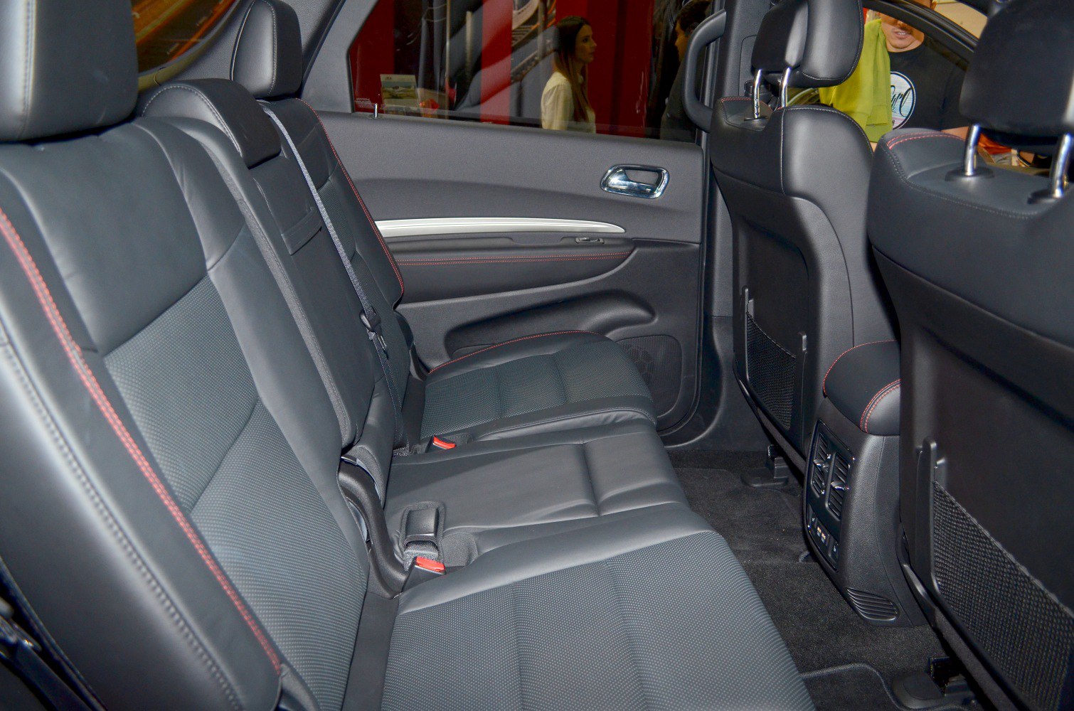 Black leather rear seats with red stitching and rear ventilation panel