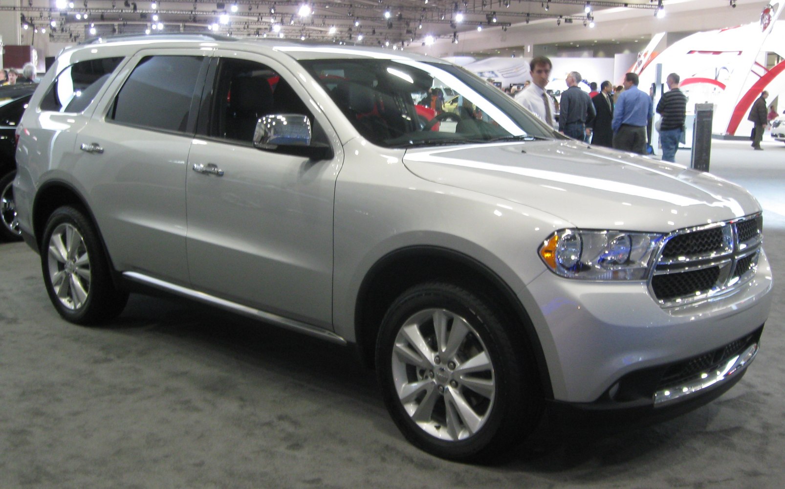 Silver mid-size SUV with chrome grille and alloy wheels