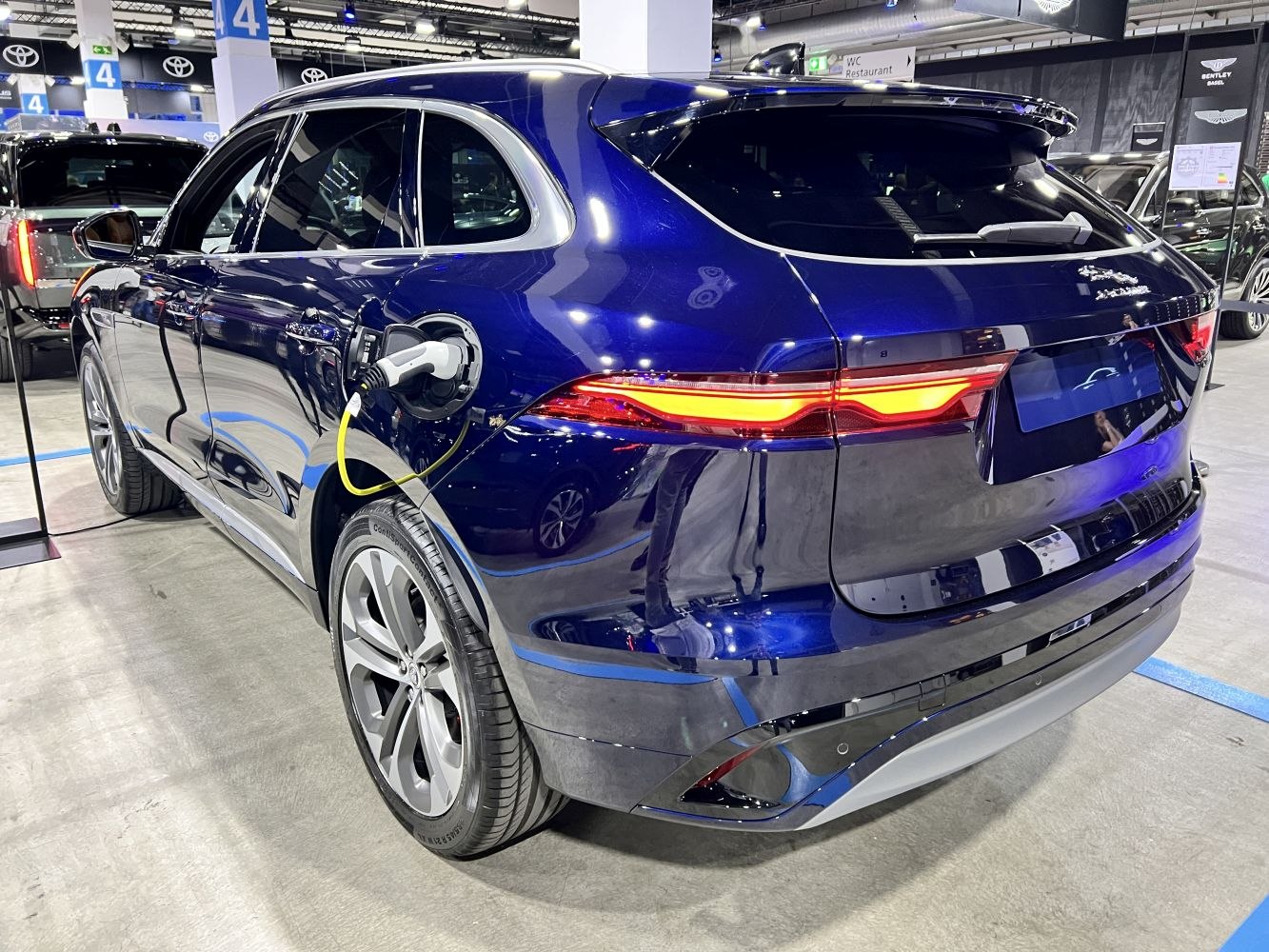 Rear view of SUV with electric charging port and LED taillights