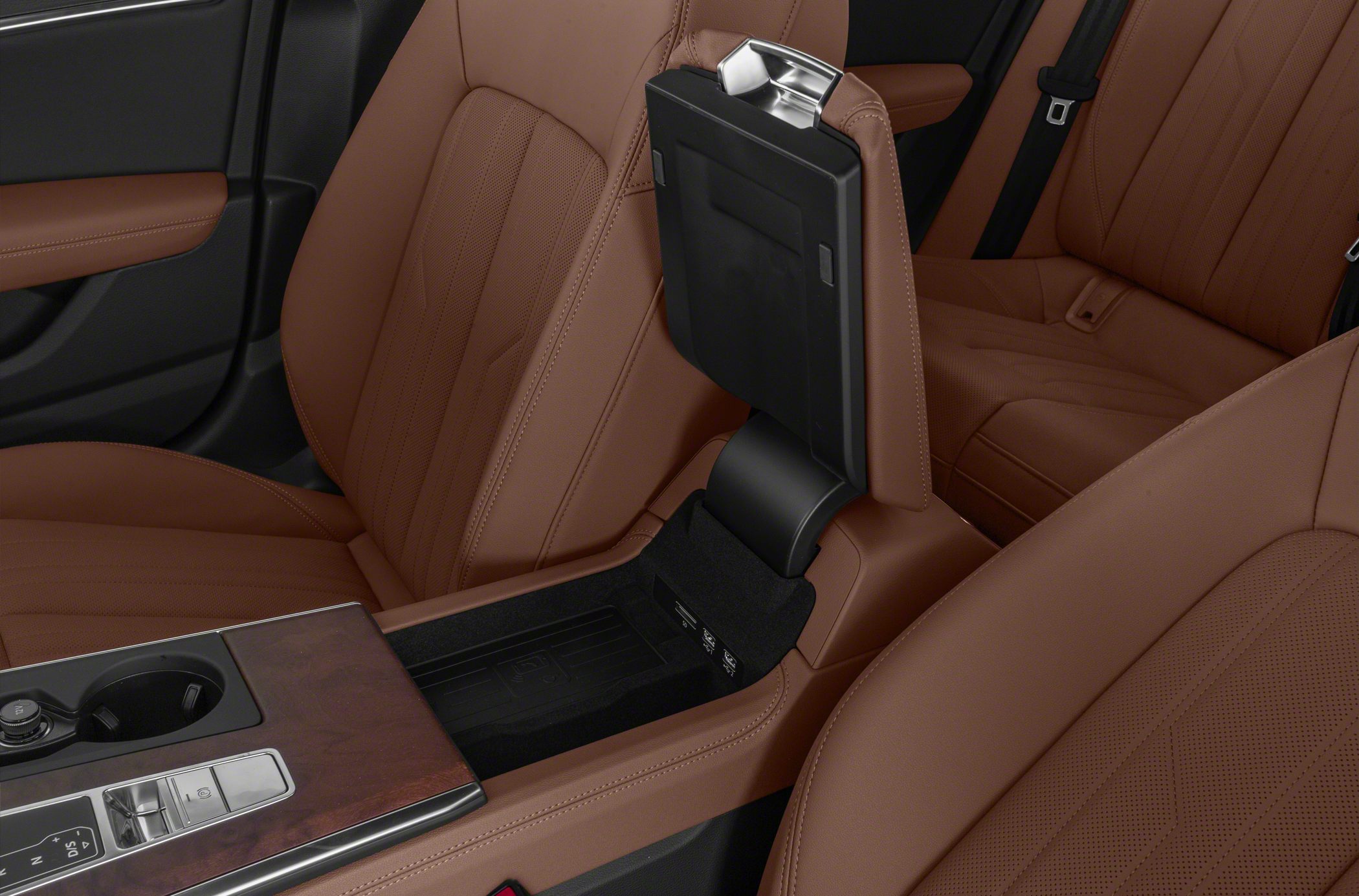 Center console with wood finish and open armrest storage