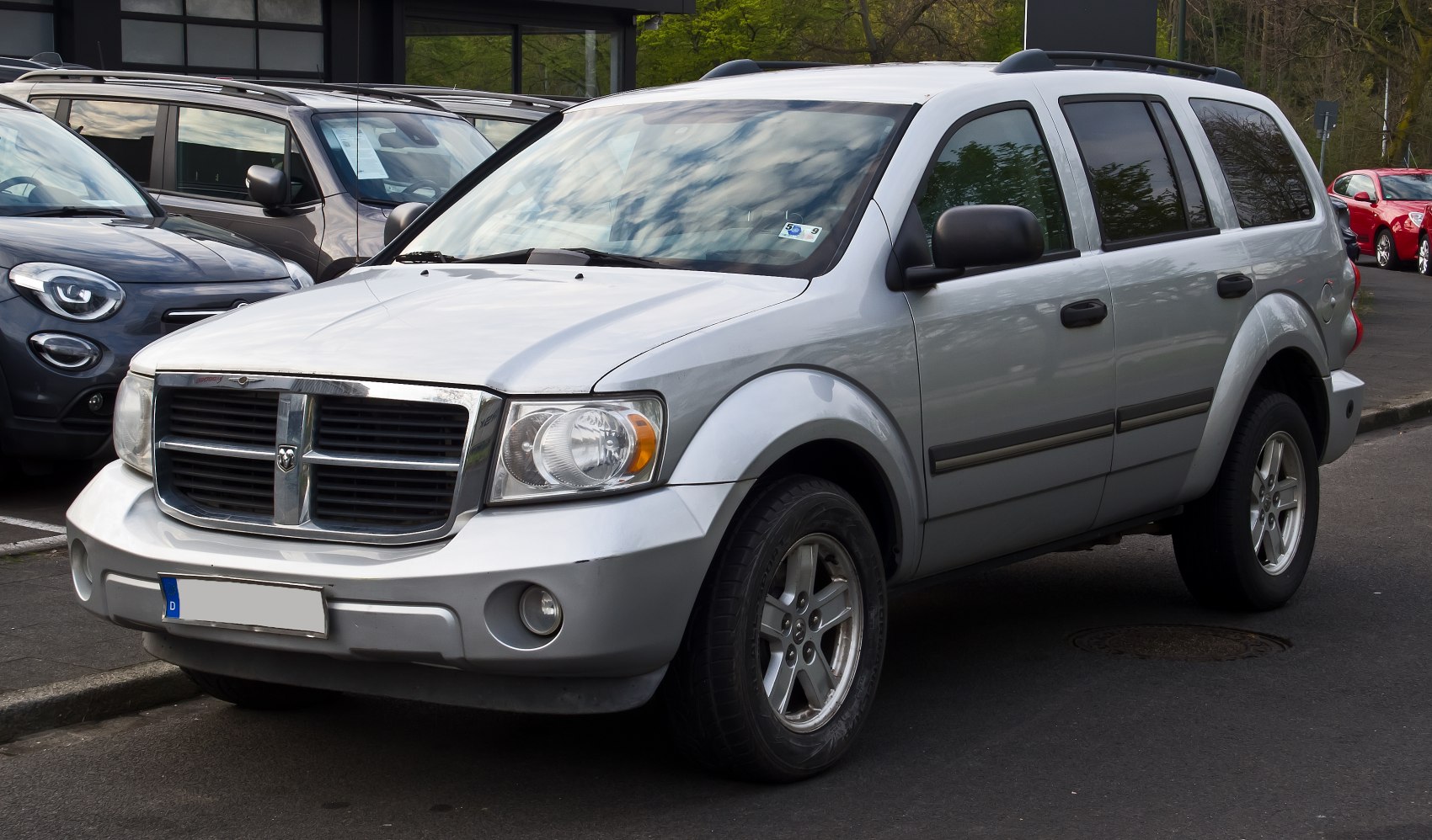 Silver SUV with distinctive grille and alloy wheels, front side angle