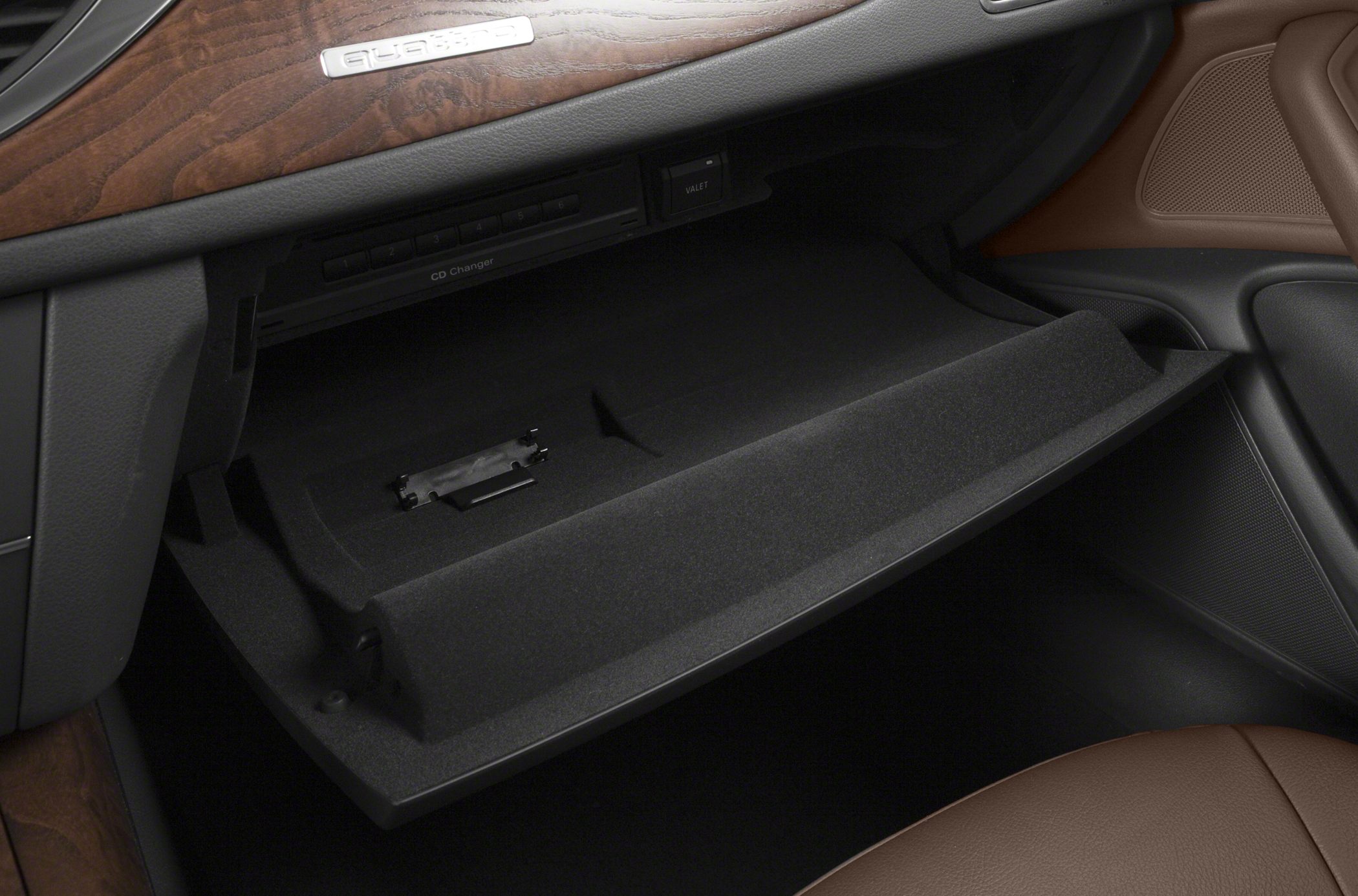 Open glove compartment with CD changer and valet switch