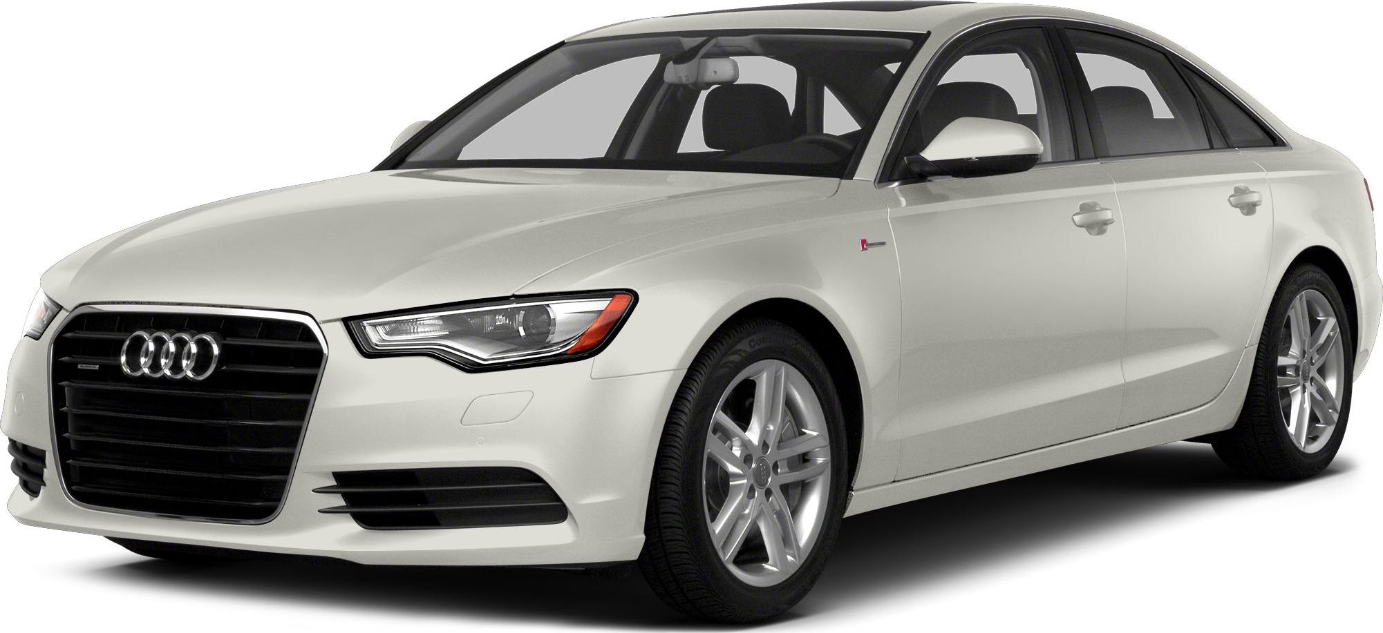 Front-side view of white luxury sedan with modern headlights and distinctive grille.