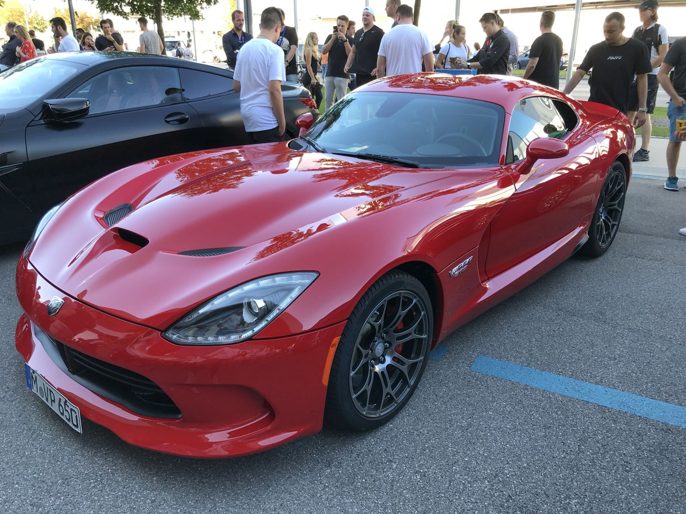 Sport coupe with sharp front vents and black alloy wheels.