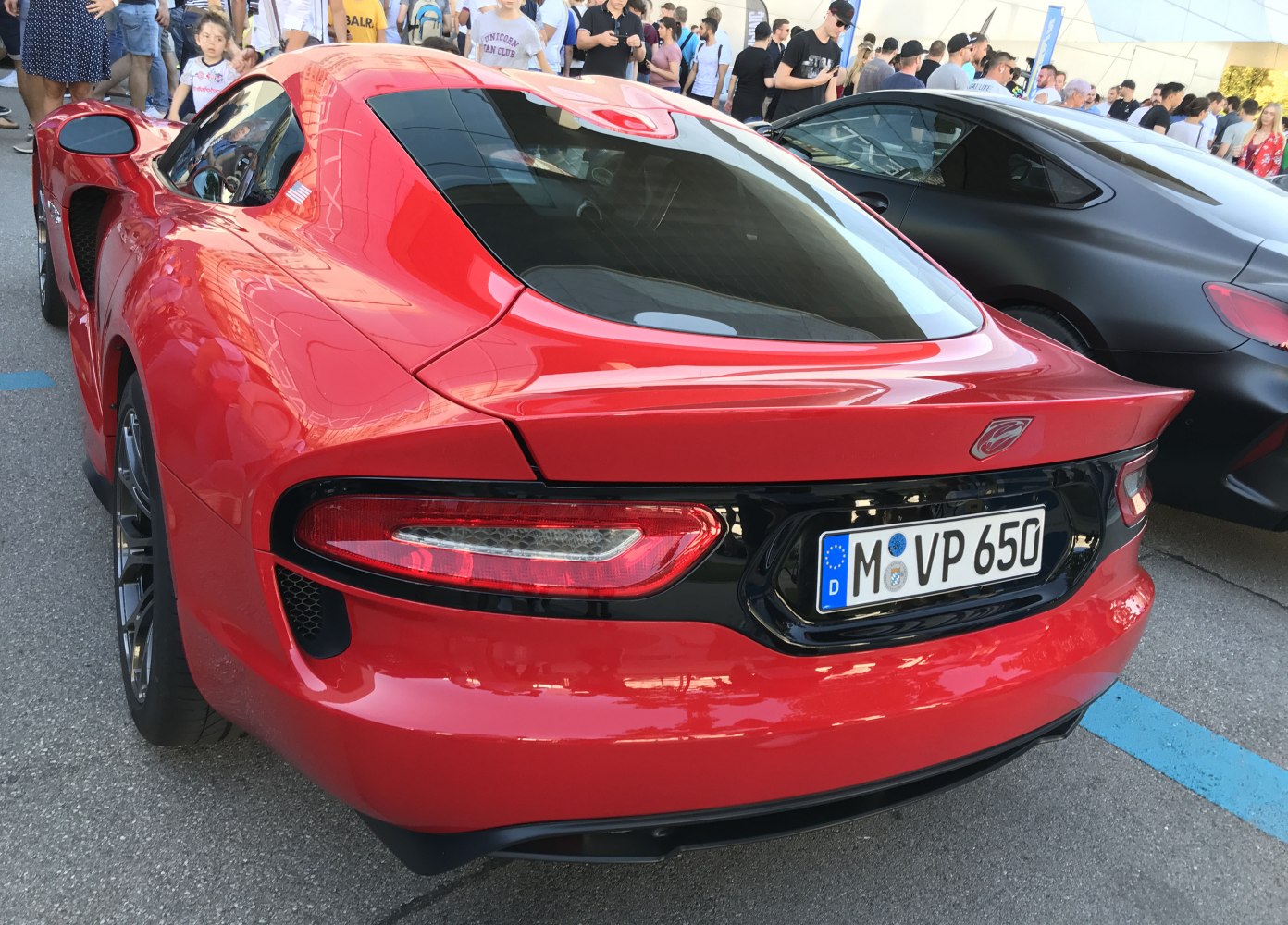 Red sports coupe with unique rear taillights and aerodynamic curves