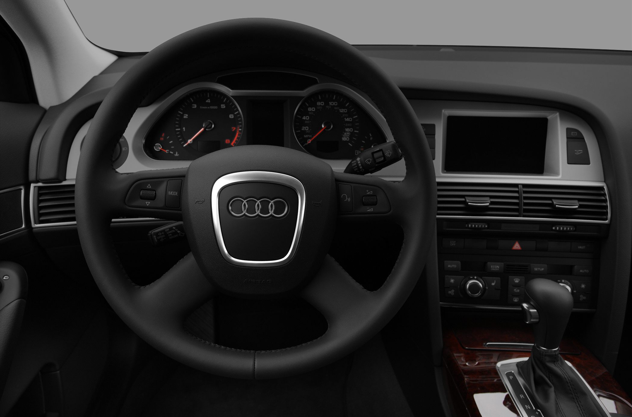 Steering wheel, instrument cluster, center console with infotainment screen and gear shift